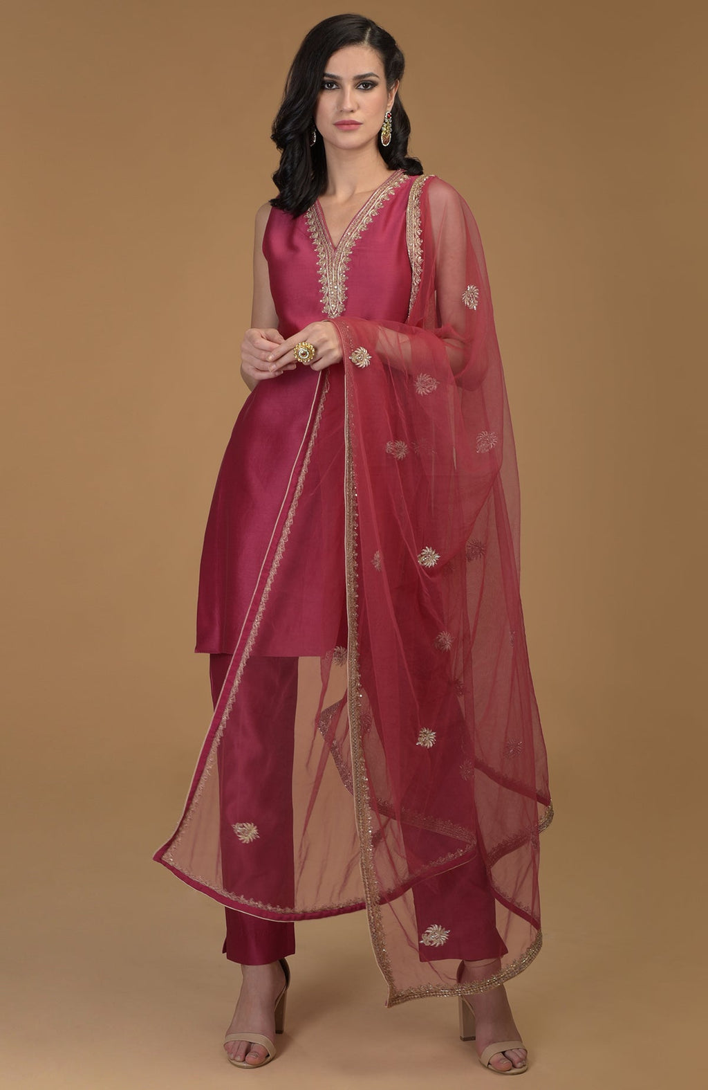 Ruby Red Zardozi Hand Embroidered Suit with a V-neck kurta, pants, and dupatta.