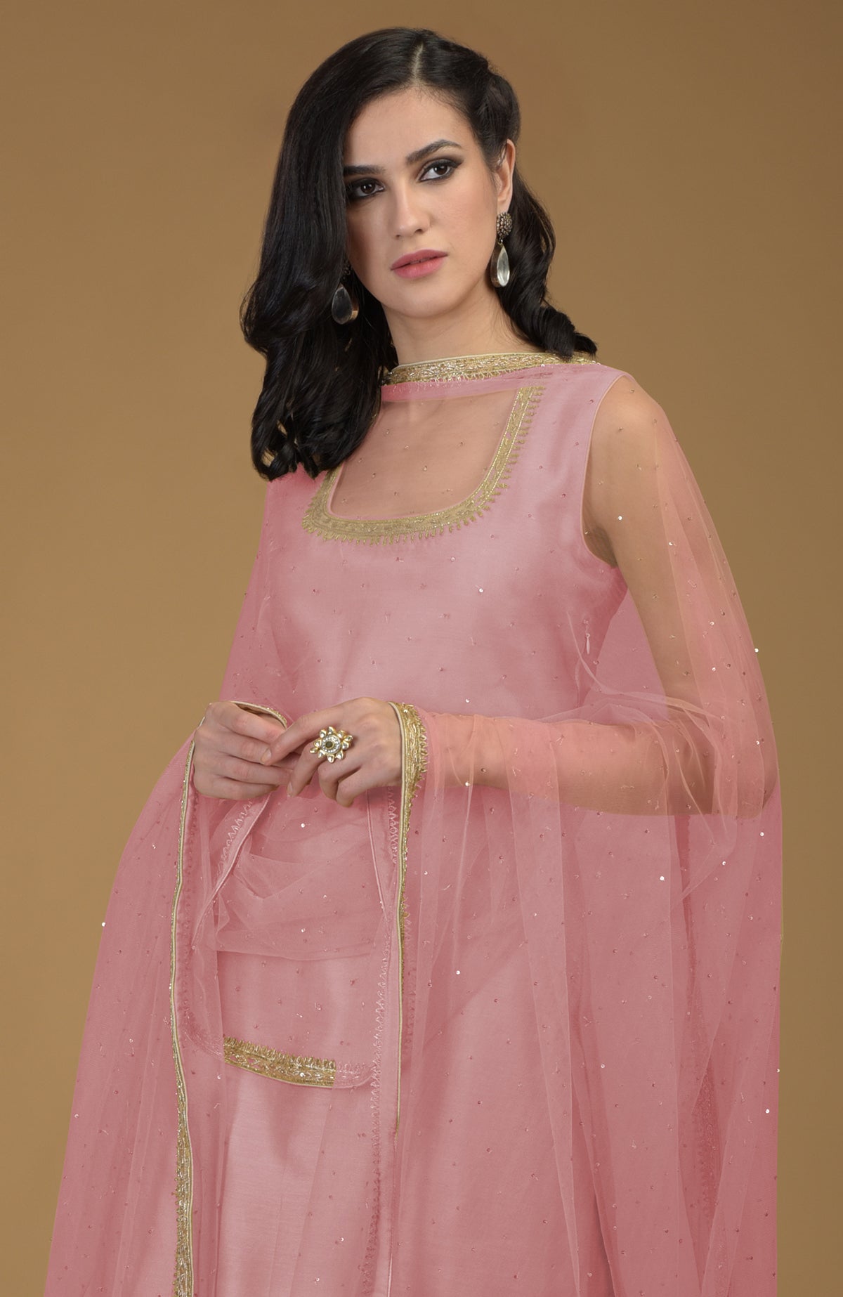 Rose tan gharara suit with gold floral hand embroidered zardozi on neckline and dupatta.