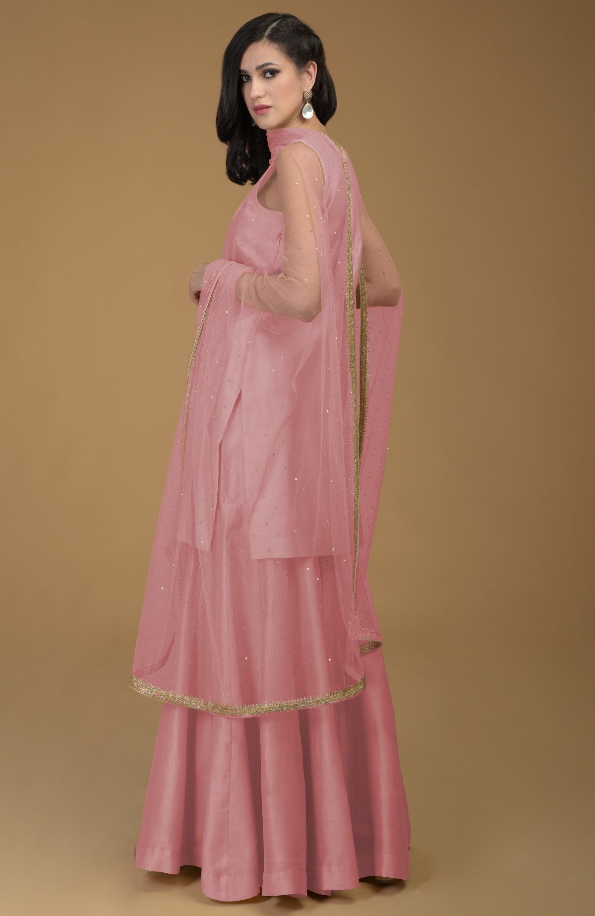 Rose tan gharara suit with gold hand embroidered zardozi on neckline and dupatta borders