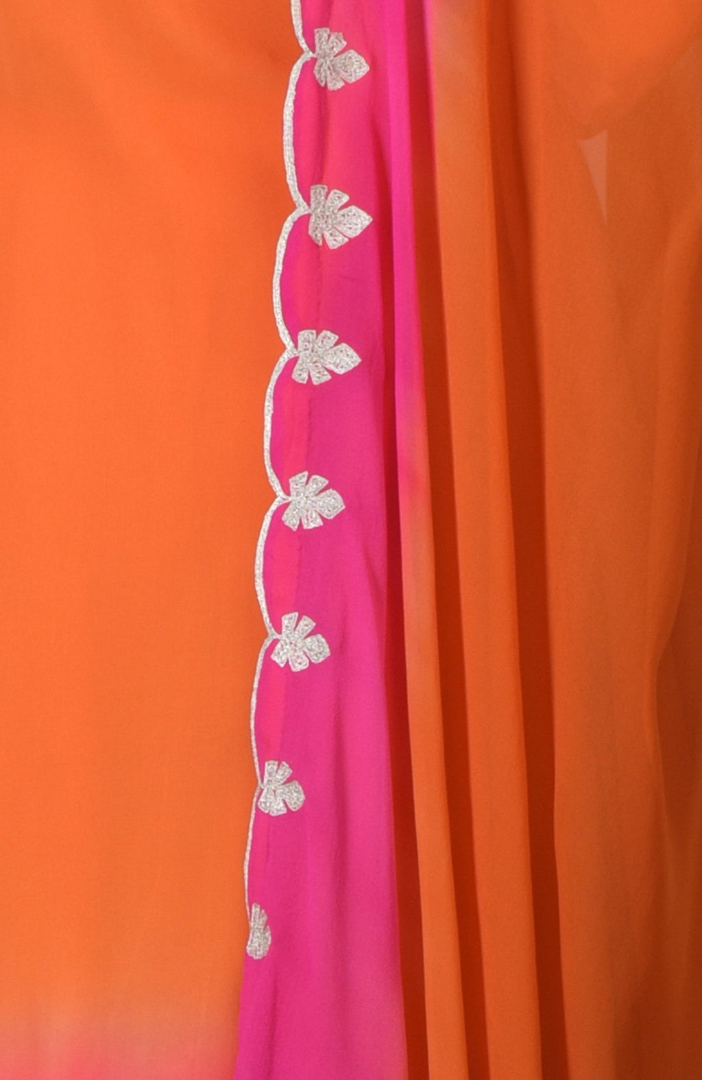 Orange and hot pink ombre fabric with silver tilla embroidery.