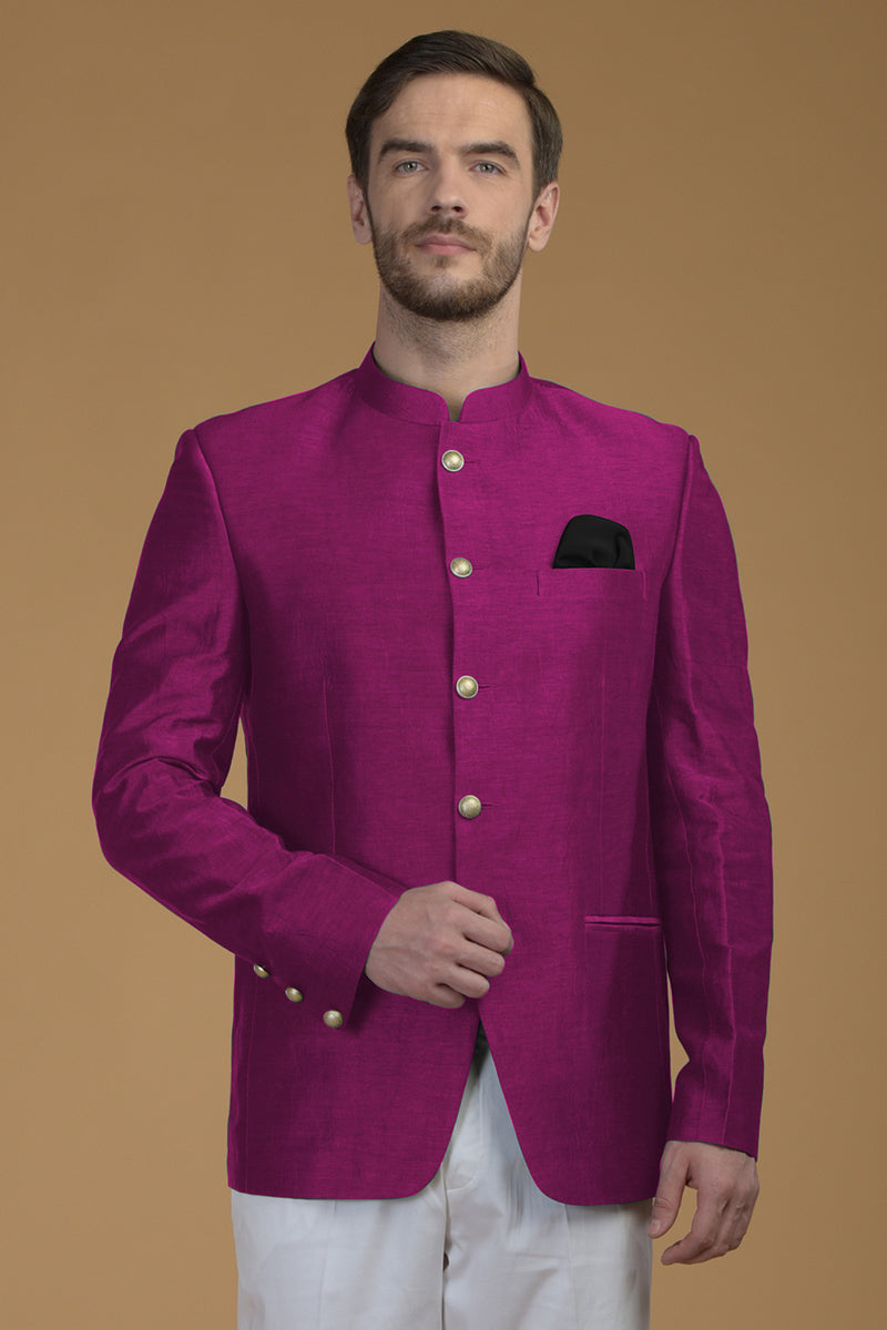 Peacock pink linen silk bandhgala jacket with a black pocket square.
