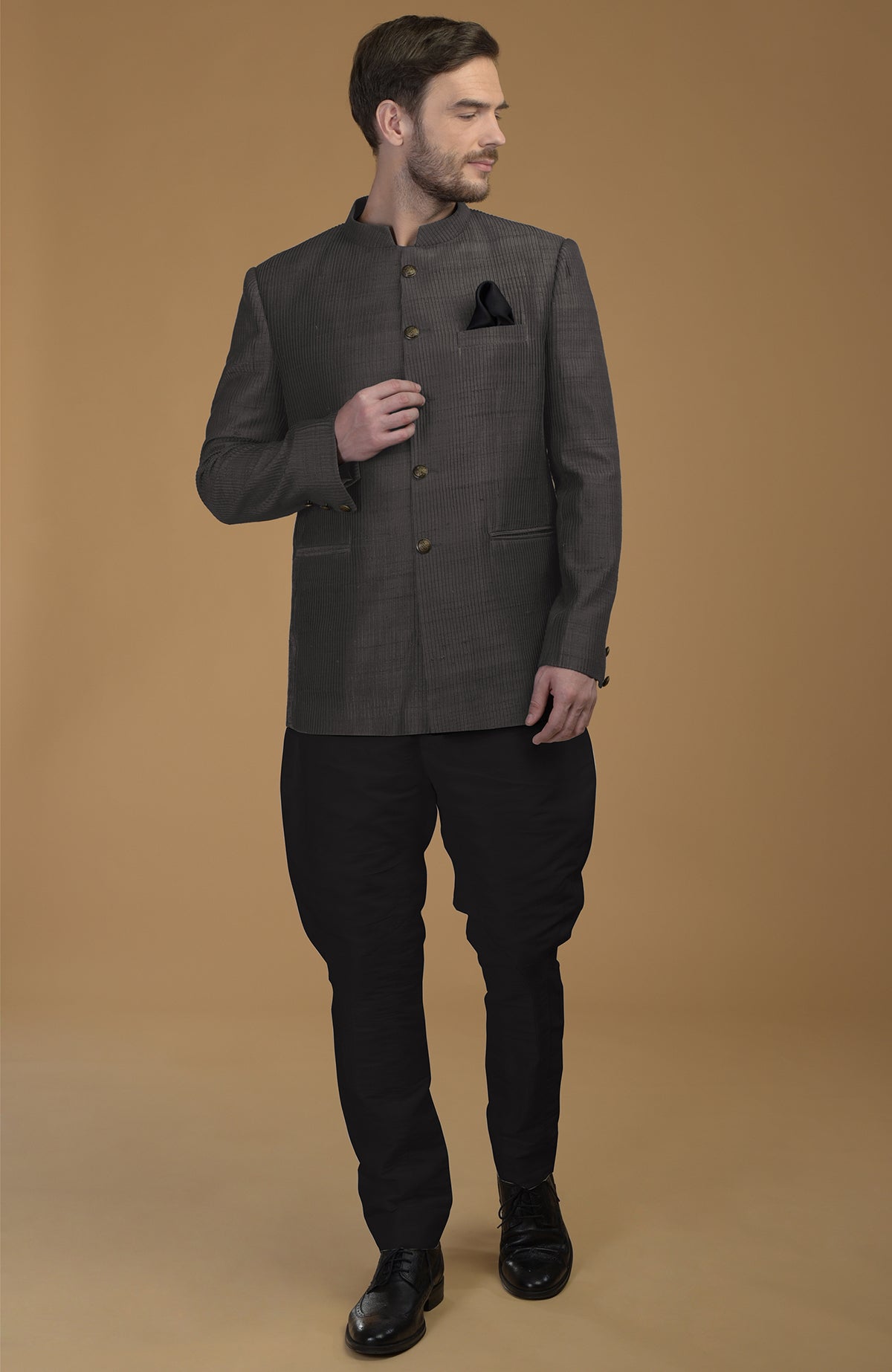 Charcoal grey pintuck pure raw silk Bandhgala jacket set with black Jodhpuri pants.