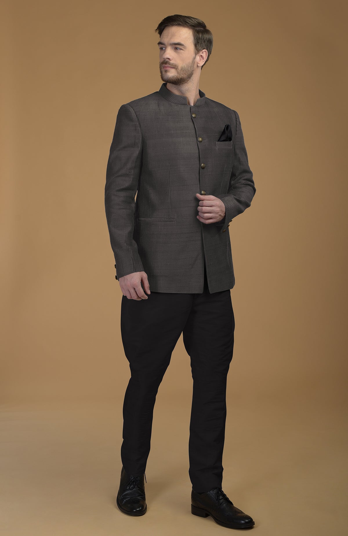 Charcoal grey pintuck pure raw silk bandhgala jacket set with black jodhpuri pants.
