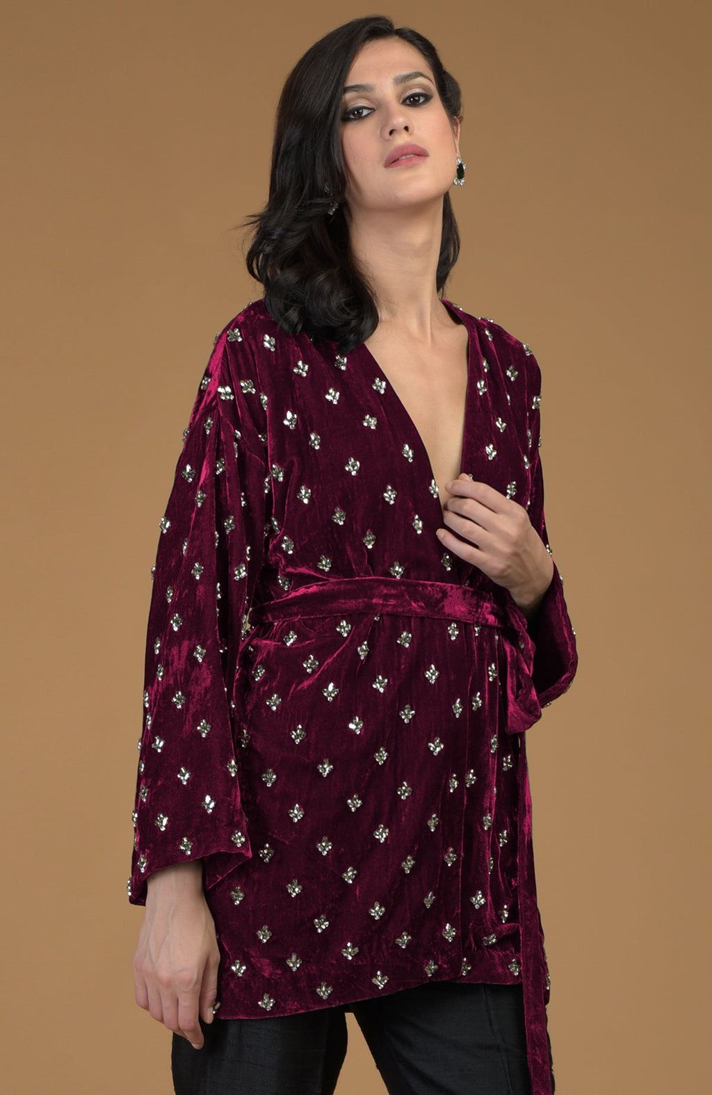 Maroon silk velvet jacket with crystal hand embroidery and a waist belt.