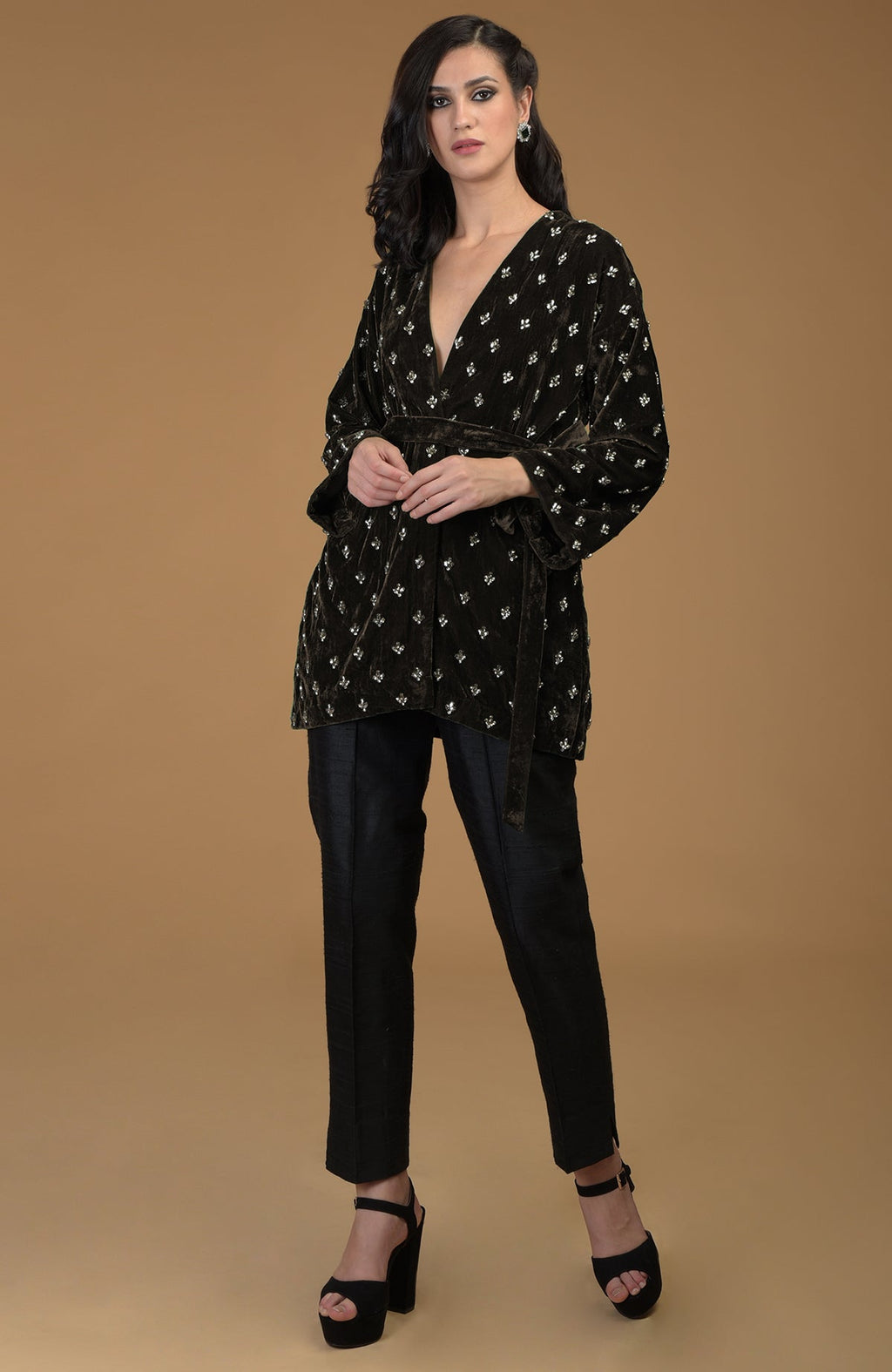 Dark olive crystal hand-embroidered silk velvet jacket with a waist belt.