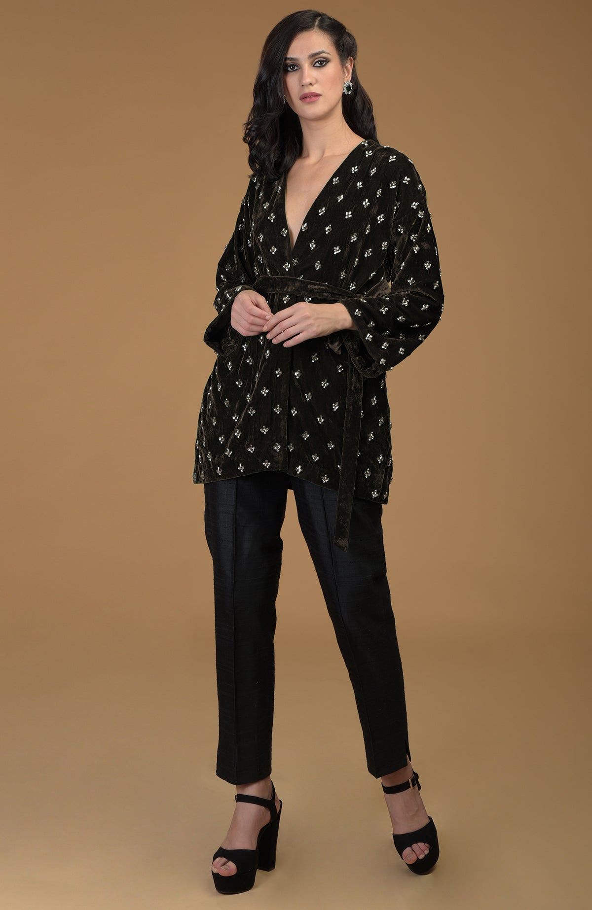 Dark olive crystal hand-embroidered silk velvet jacket with a waist belt.