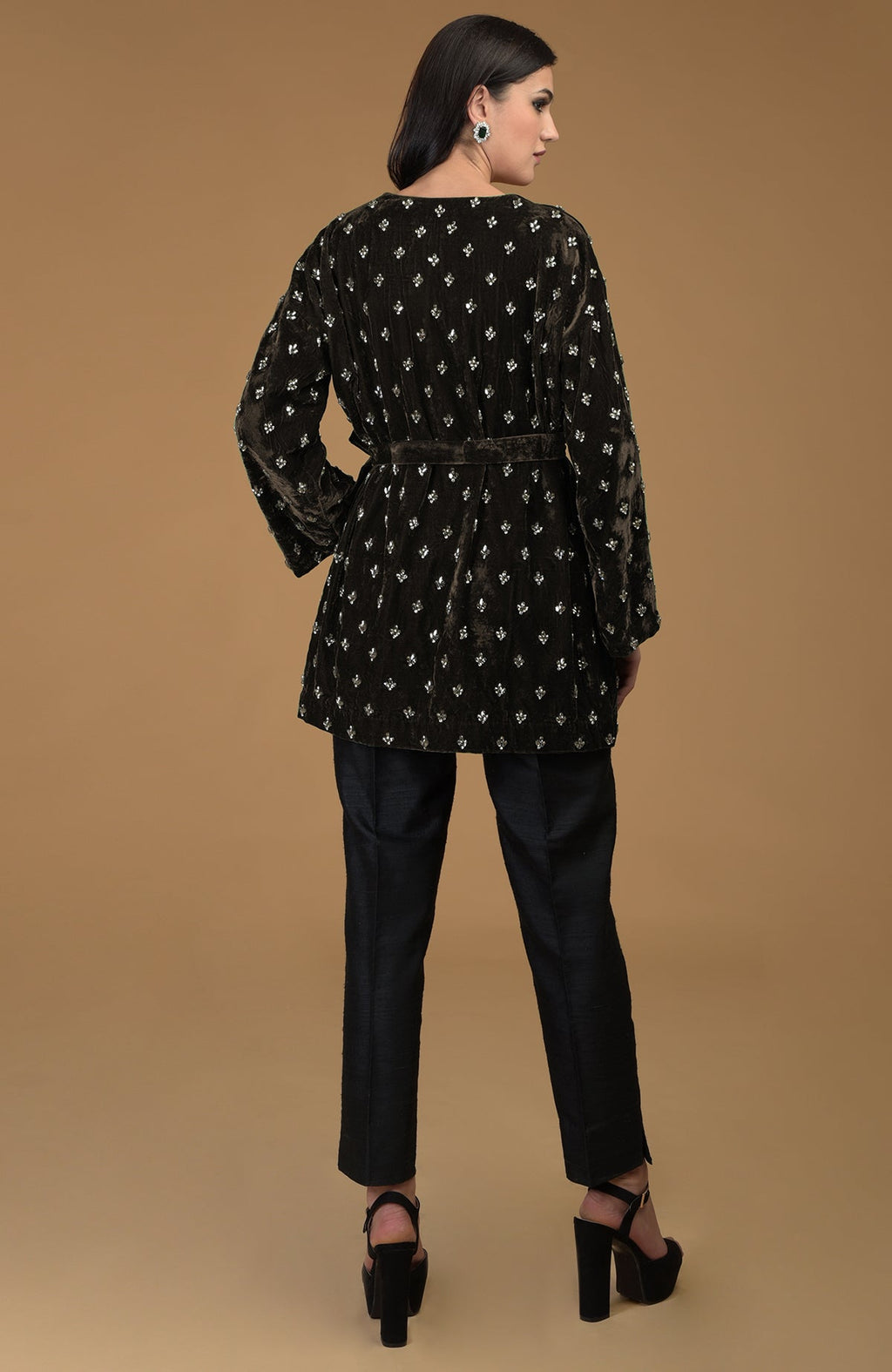 Dark olive crystal hand embroidered silk velvet jacket with a waist belt.