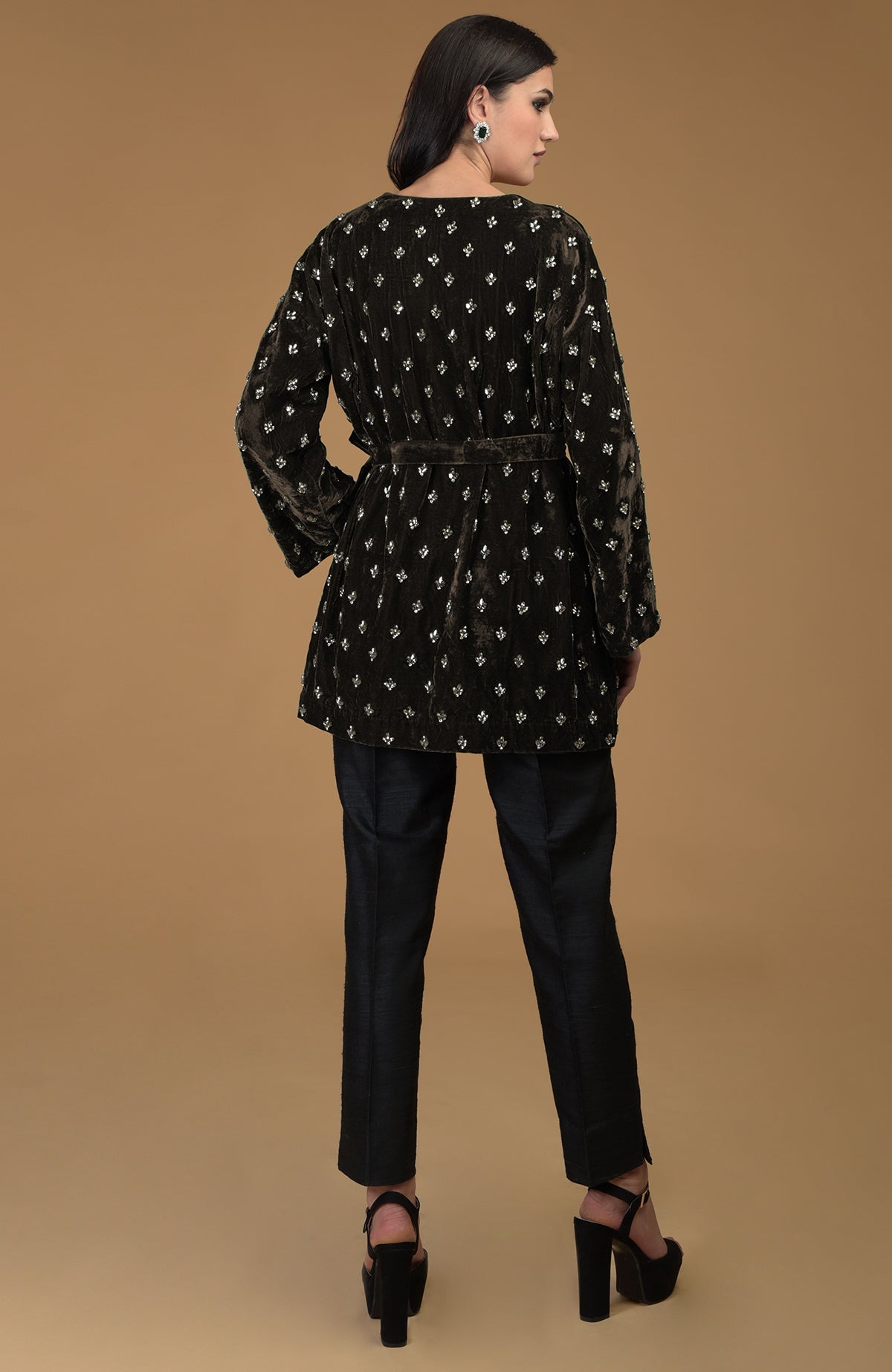 Dark olive crystal hand embroidered silk velvet jacket with a waist belt.