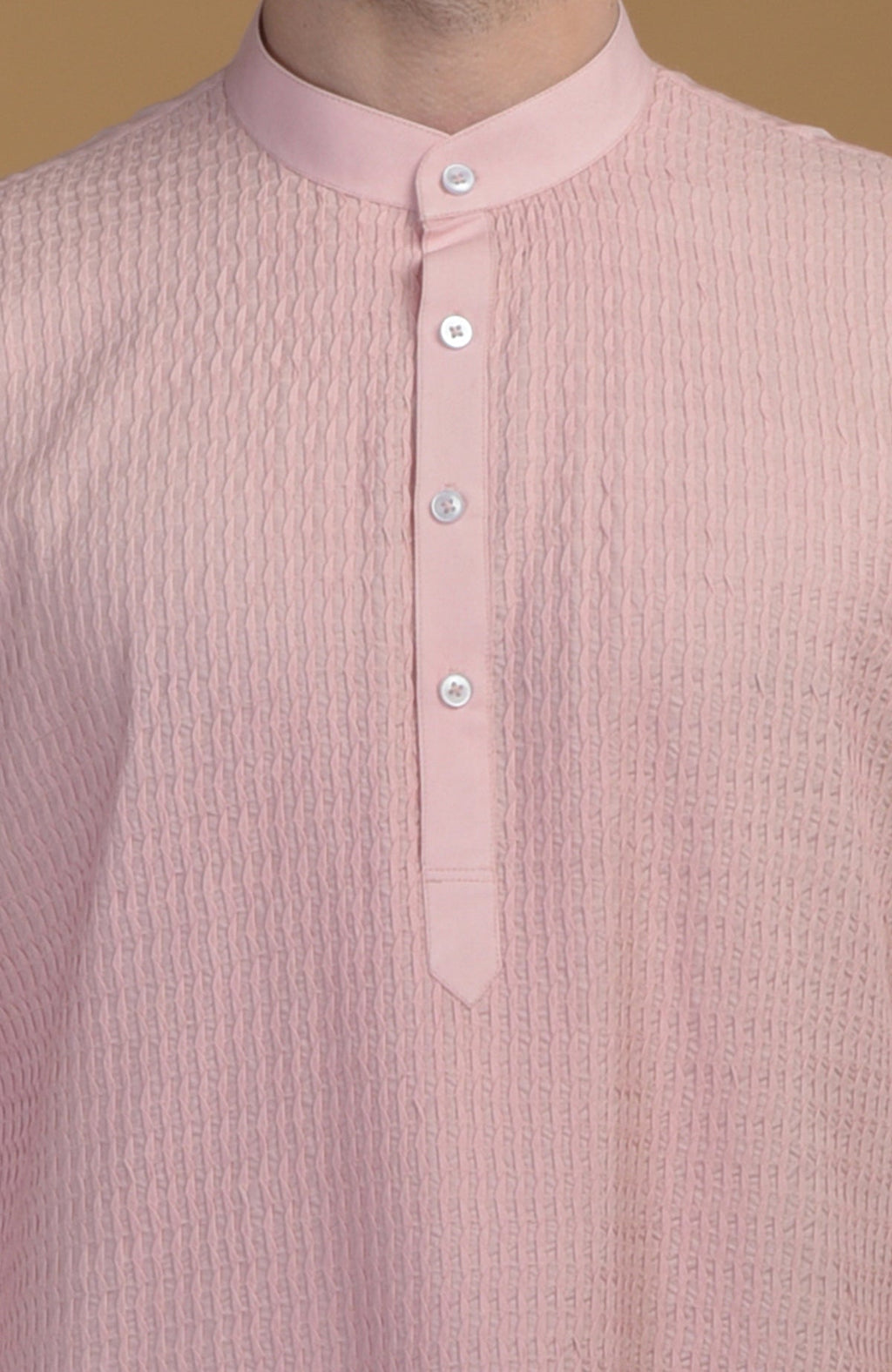 Pale pink kurta with pintuck detail and a buttoned placket.