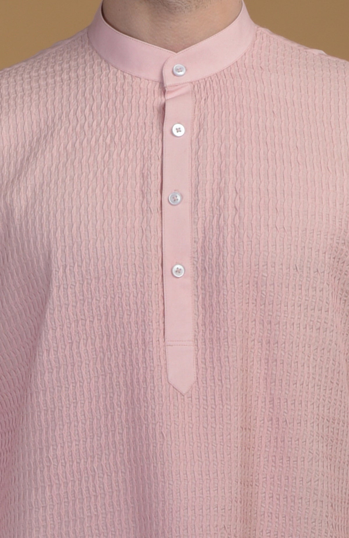 Pale pink kurta with pintuck detail and a buttoned placket.