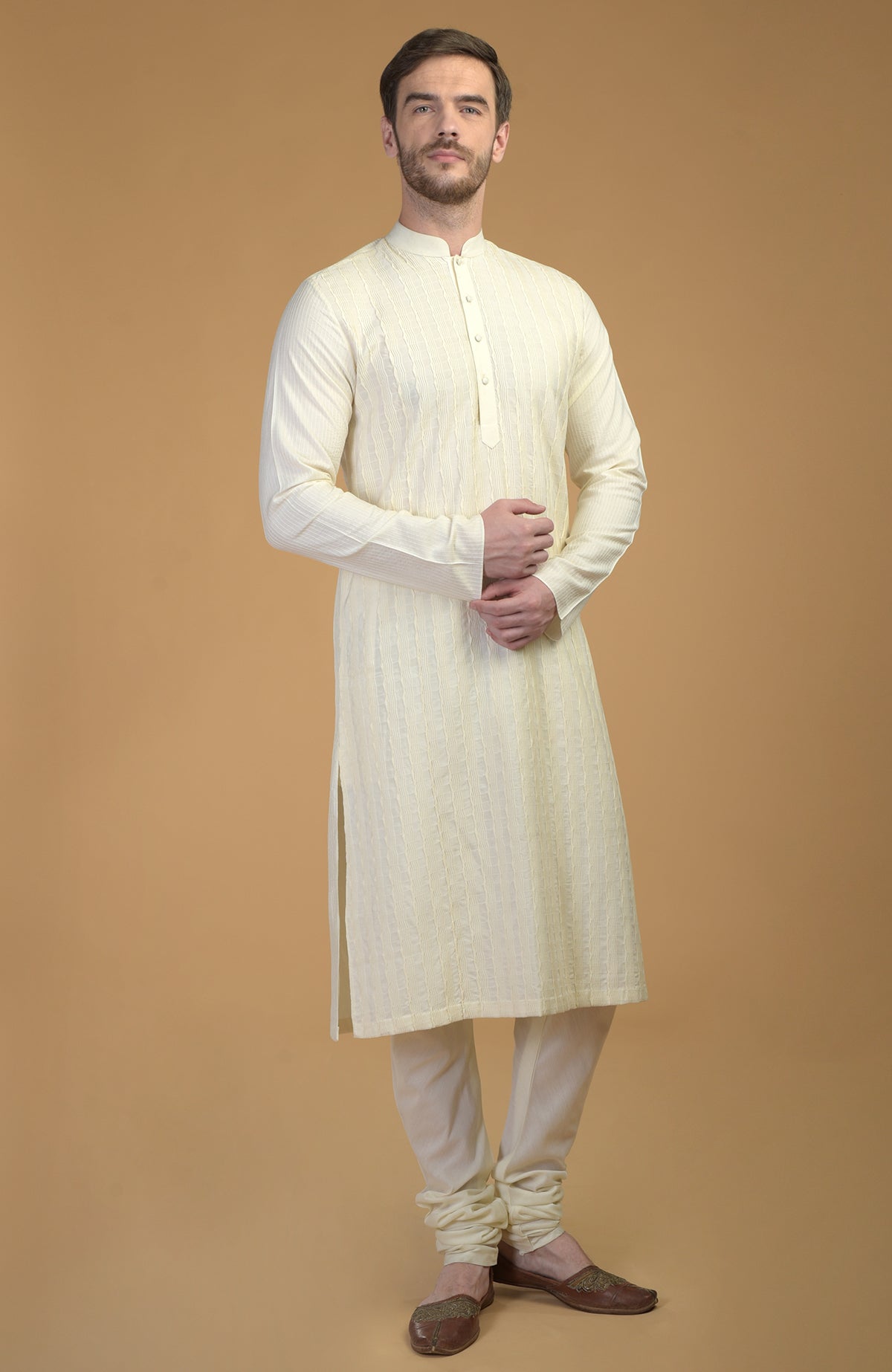 Cream kurta with pintuck and Kantha detail.