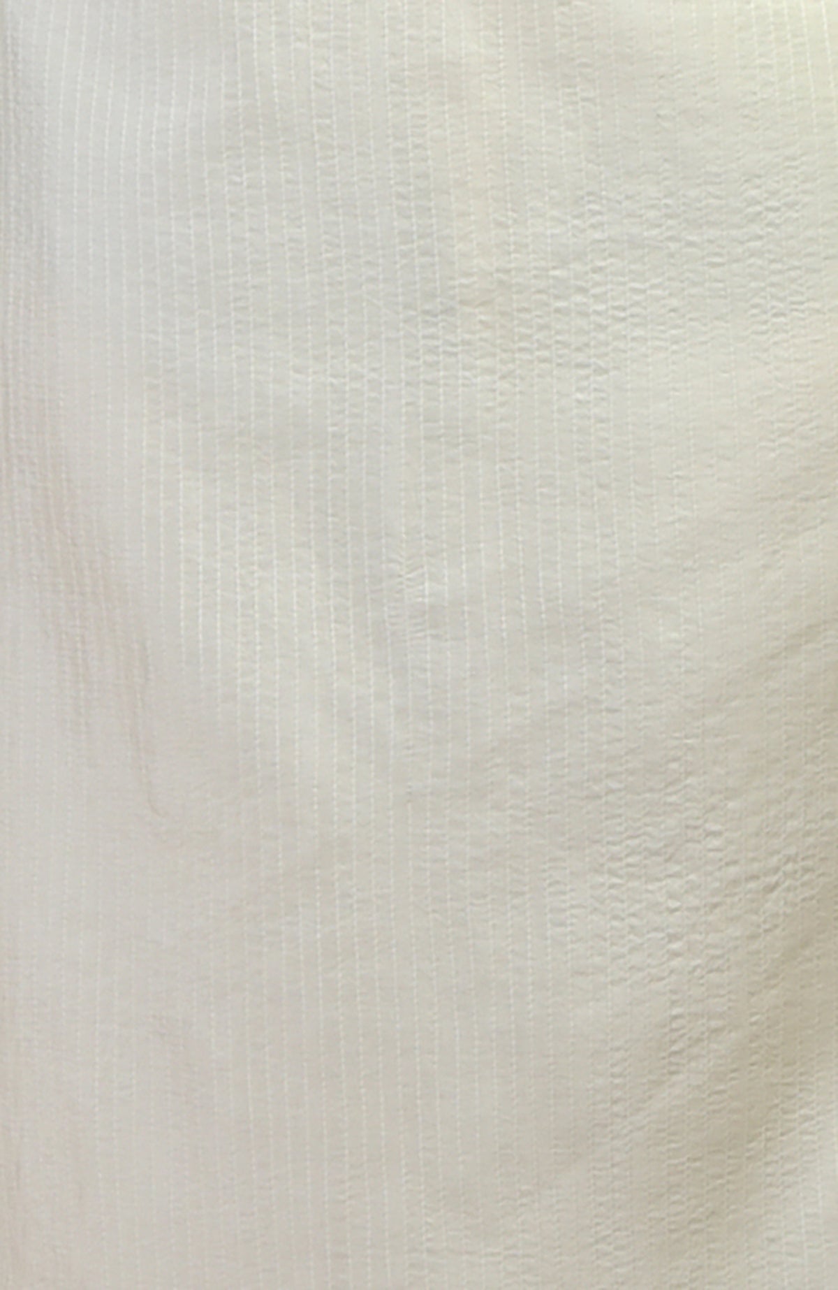 Cream kurta with vertical pintuck and kantha stitching.