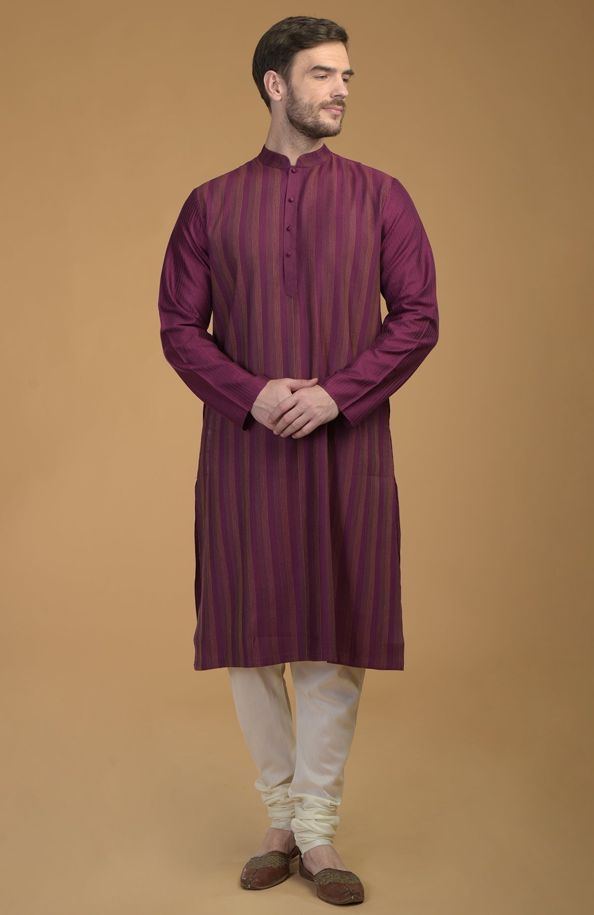 Plum striped kurta with pintuck and kantha detail, paired with ivory churidar.