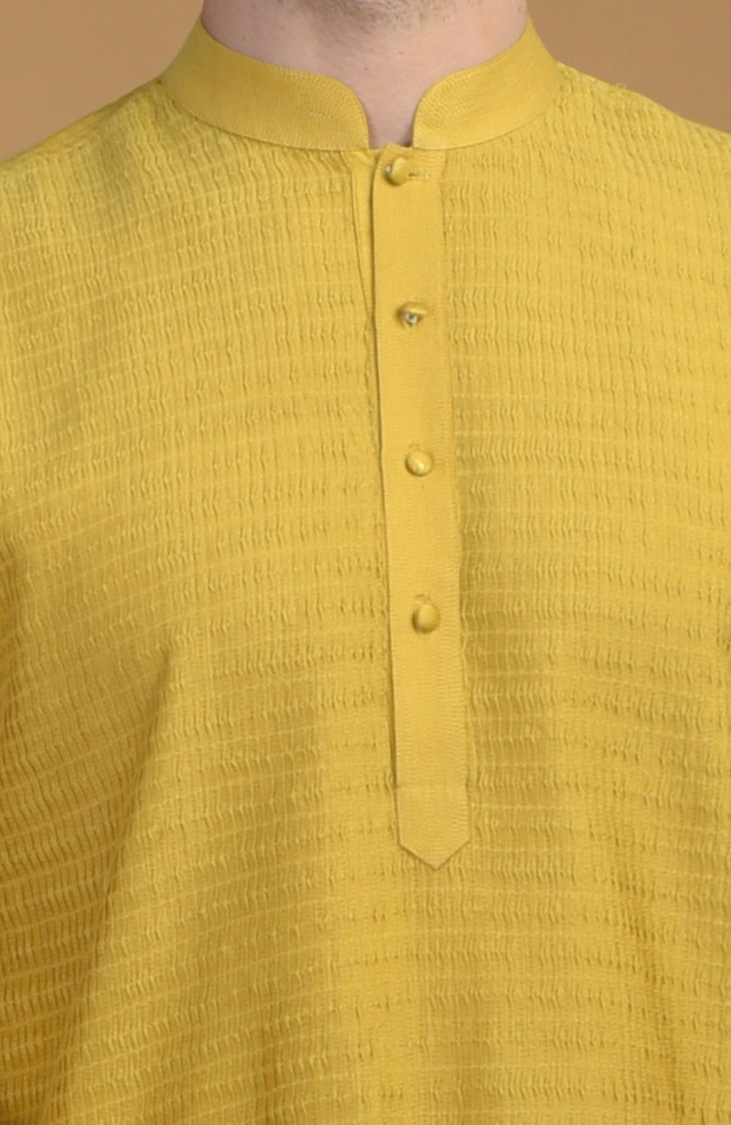 Sunglow yellow kurta with pintuck and Kantha detail, featuring a buttoned placket.