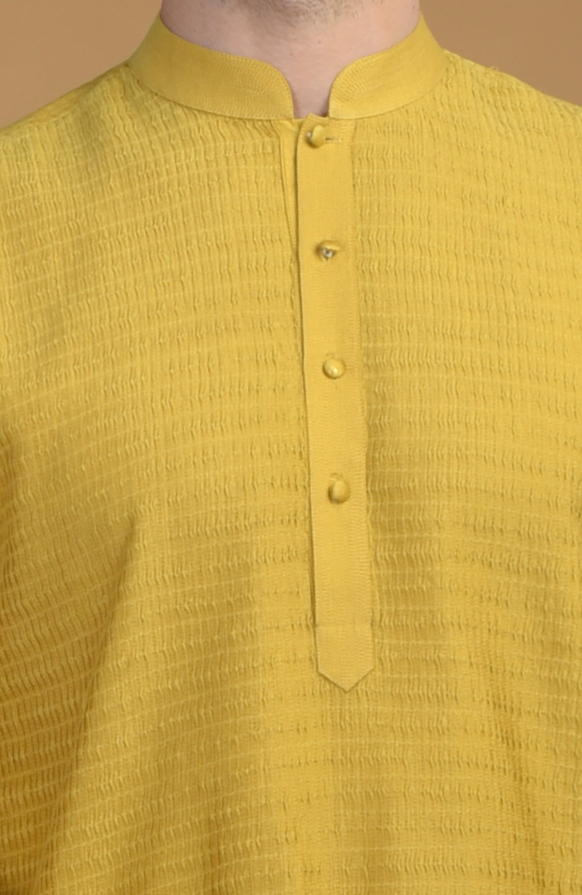 Sunglow yellow kurta with pintuck and Kantha detail, featuring a buttoned placket.