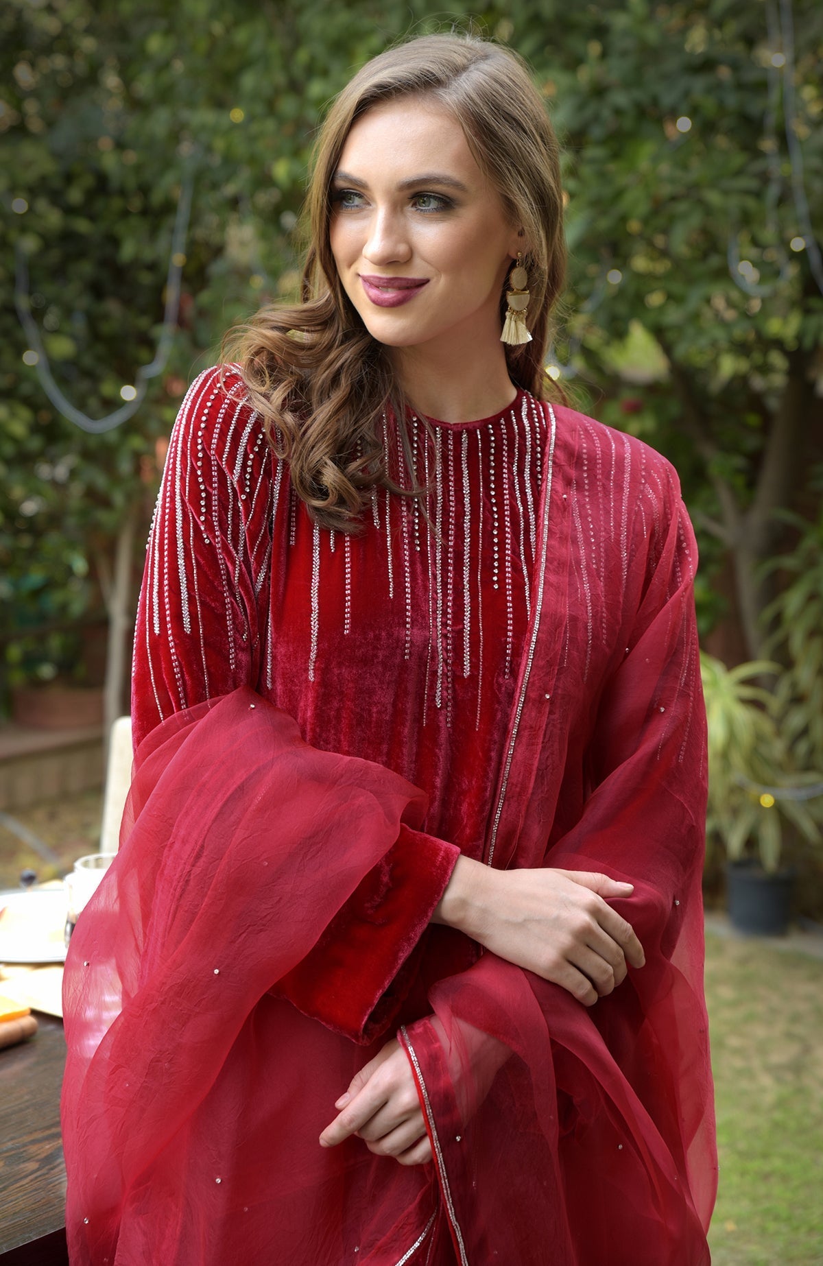 Cherry red velvet kurta set with crystal and bead embroidery.