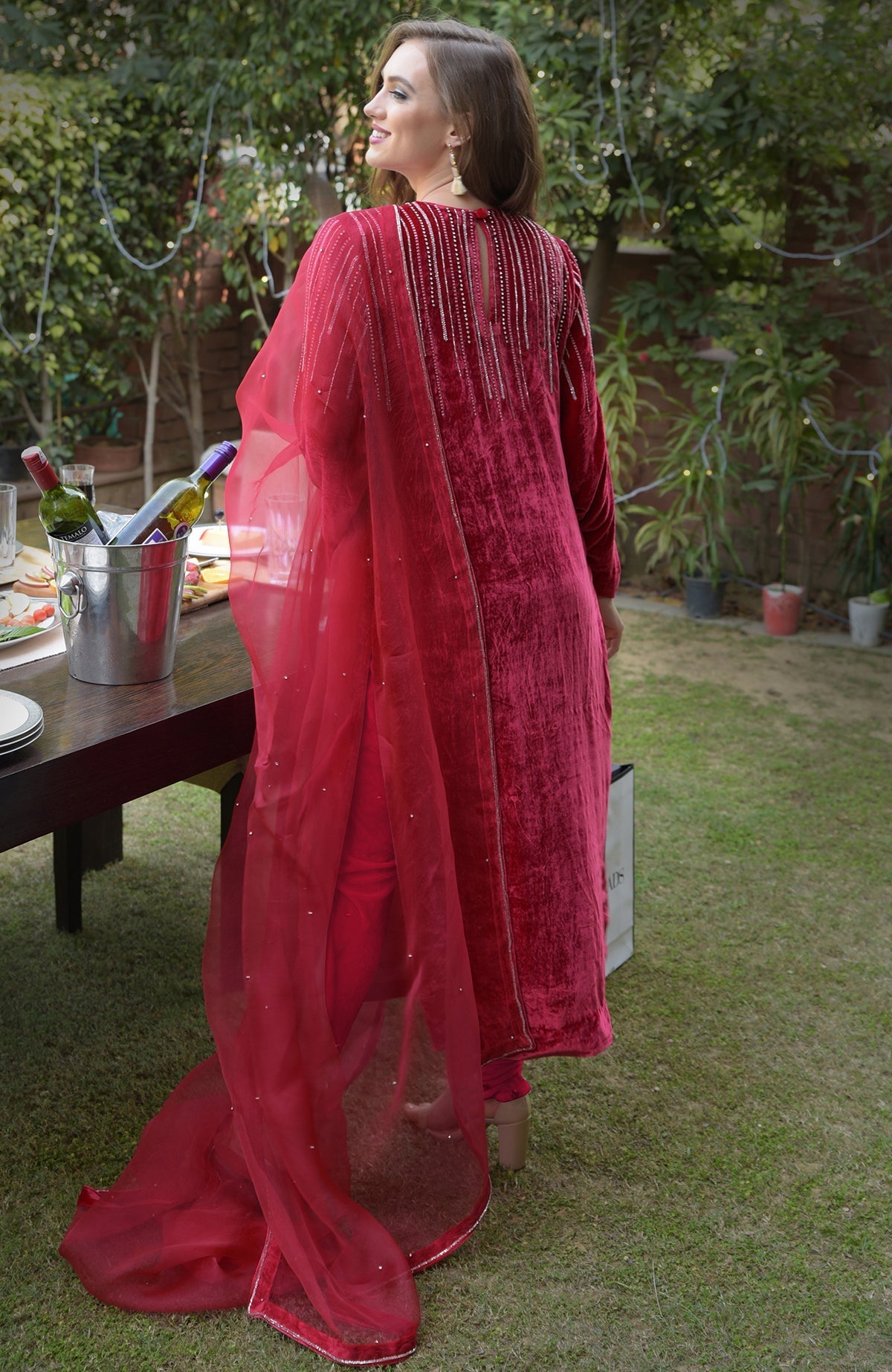 Cherry red velvet kurta set with crystal and bead embroidery.