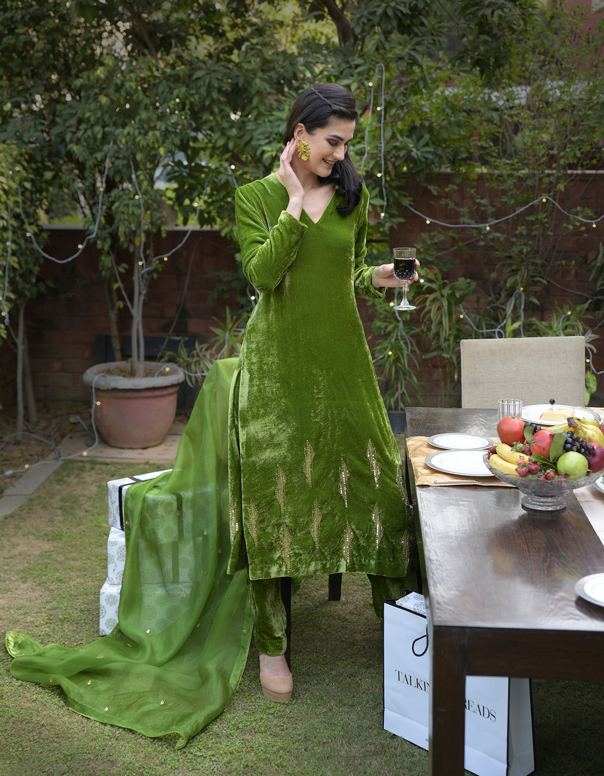 Pepper Stem Green velvet kurta set with gilded bead and sequin embroidery.