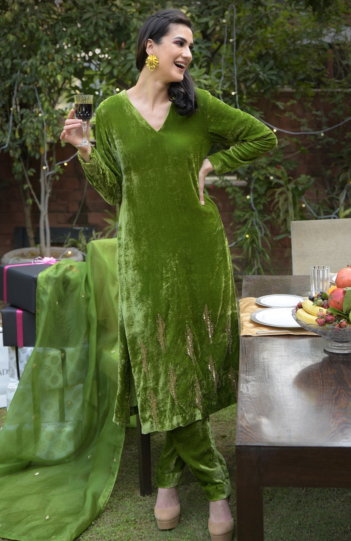 Pepper Stem Green velvet kurta set with gilded bead and sequin embroidery.