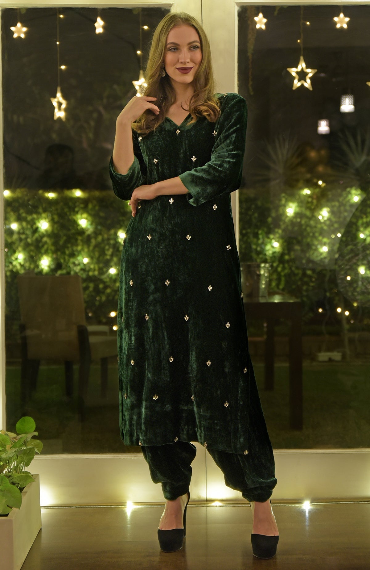 Emerald green velvet kurta set with Swarovski hand embroidery.