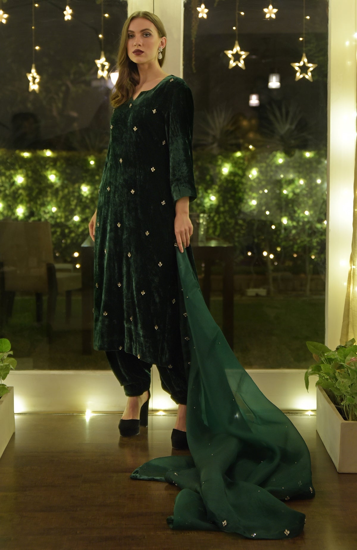 Emerald green velvet kurta set with Swarovski hand embroidery.