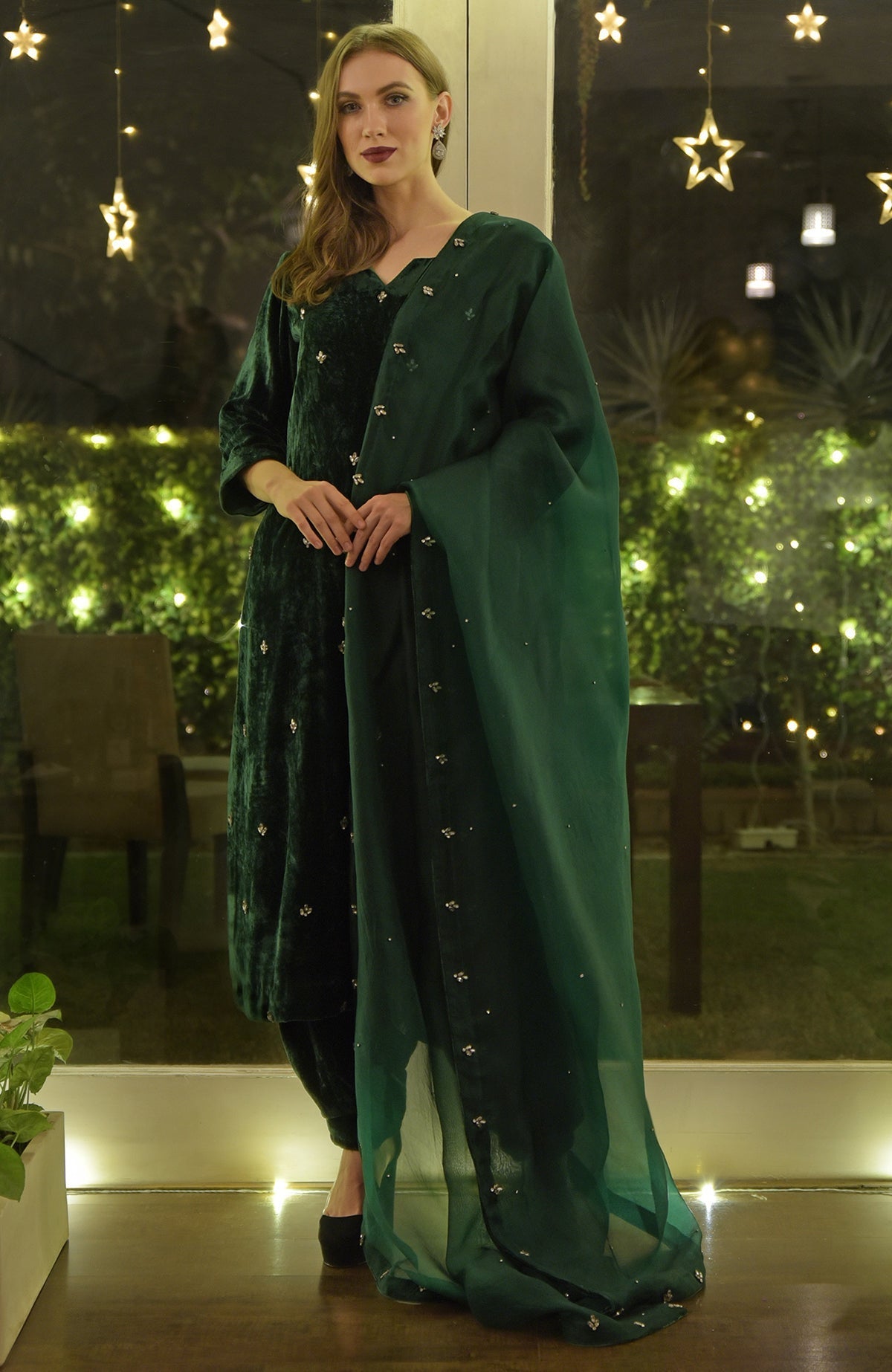 Emerald green velvet kurta set with Swarovski hand embroidery.
