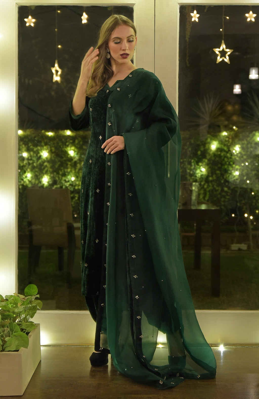 Emerald green velvet kurta set with Swarovski hand embroidery.