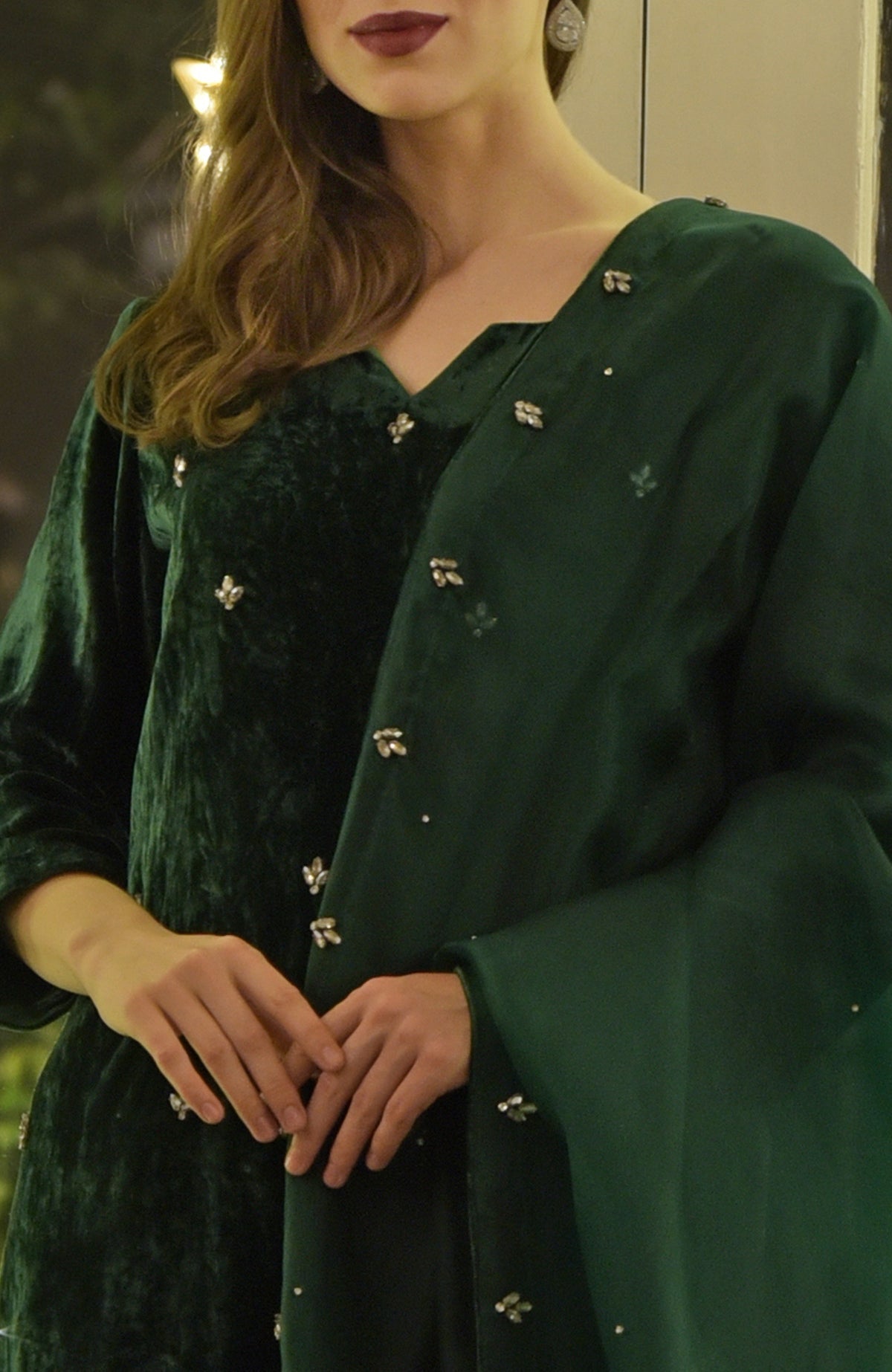 Emerald green velvet kurta set with Swarovski crystal hand embroidery.