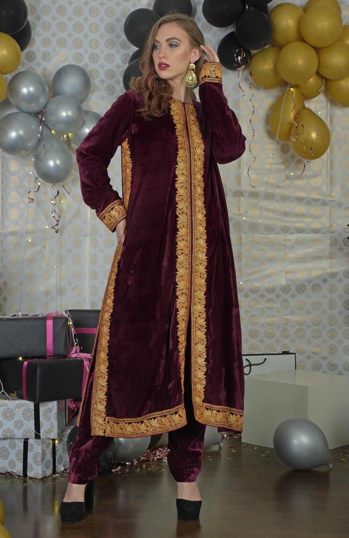 Burgundy velvet kurta set with gold Kashmir Tilla embroidery.