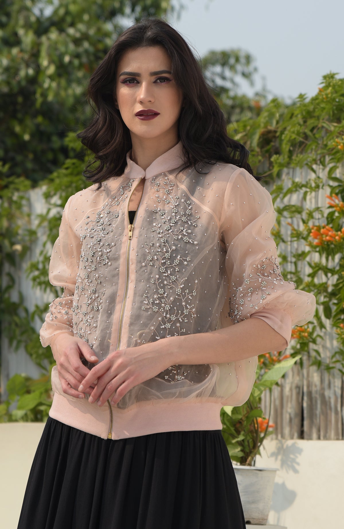 Peach organza bomber jacket with crystal floweret hand embroidery.