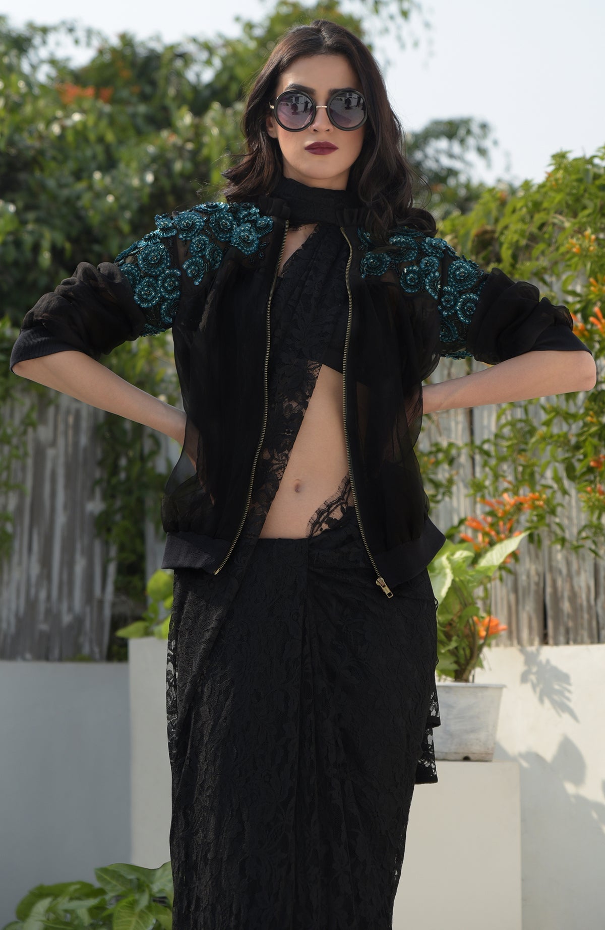 Black organza bomber jacket with blue 3D floral hand embroidery and ribbed cuffs and hem