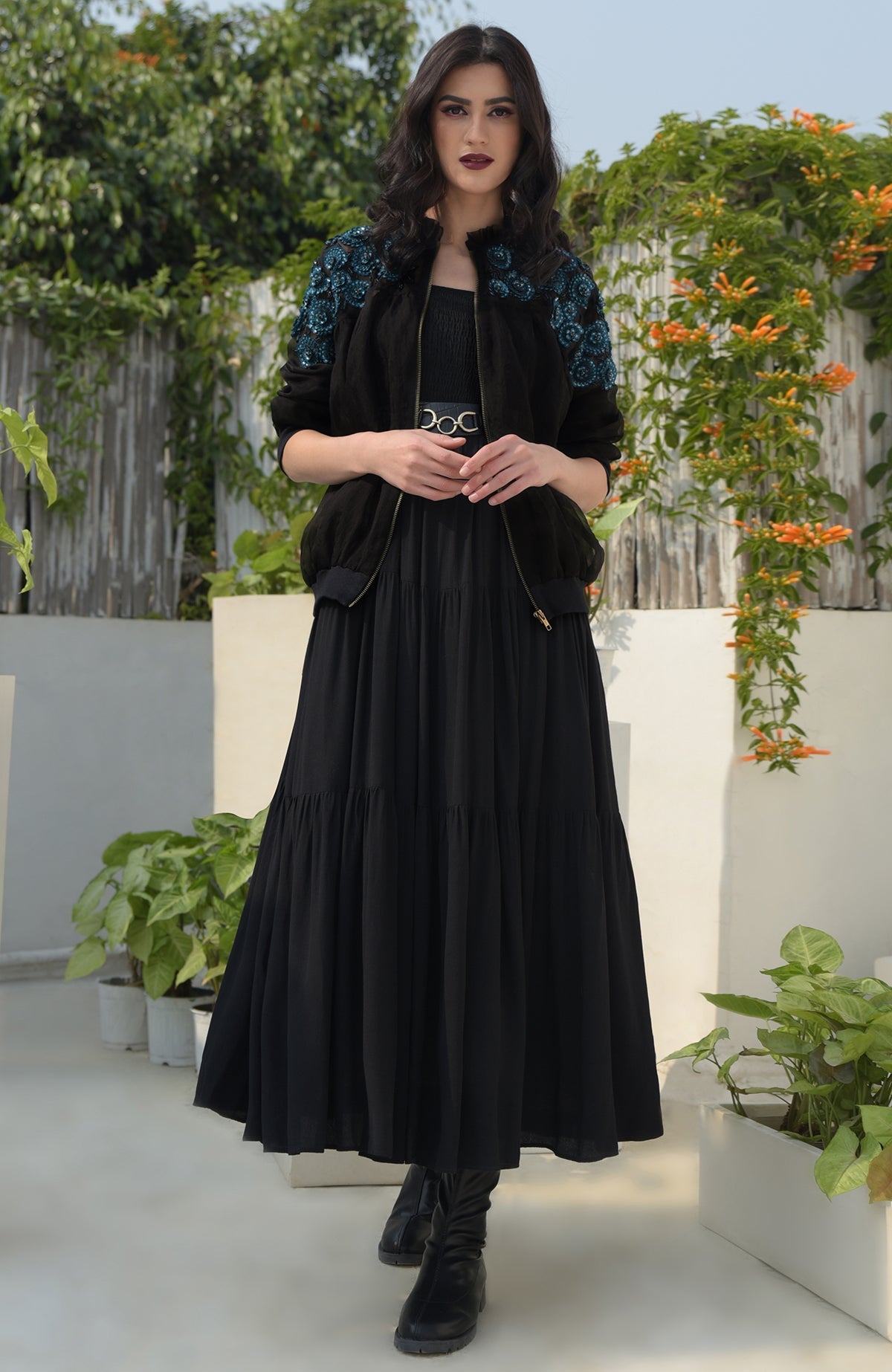 Black organza bomber jacket with blue 3D floral hand embroidery and ribbed cuffs and hem