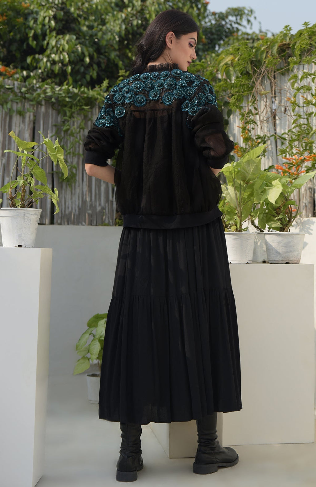 Black organza bomber jacket with blue 3D floral hand embroidery and ribbed cuffs and hem