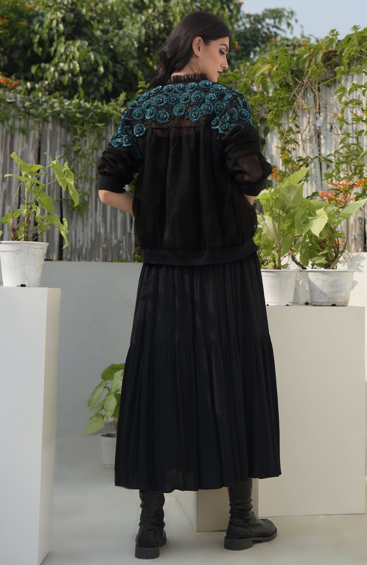 Black organza bomber jacket with blue 3D floral hand embroidery and ribbed cuffs and hem