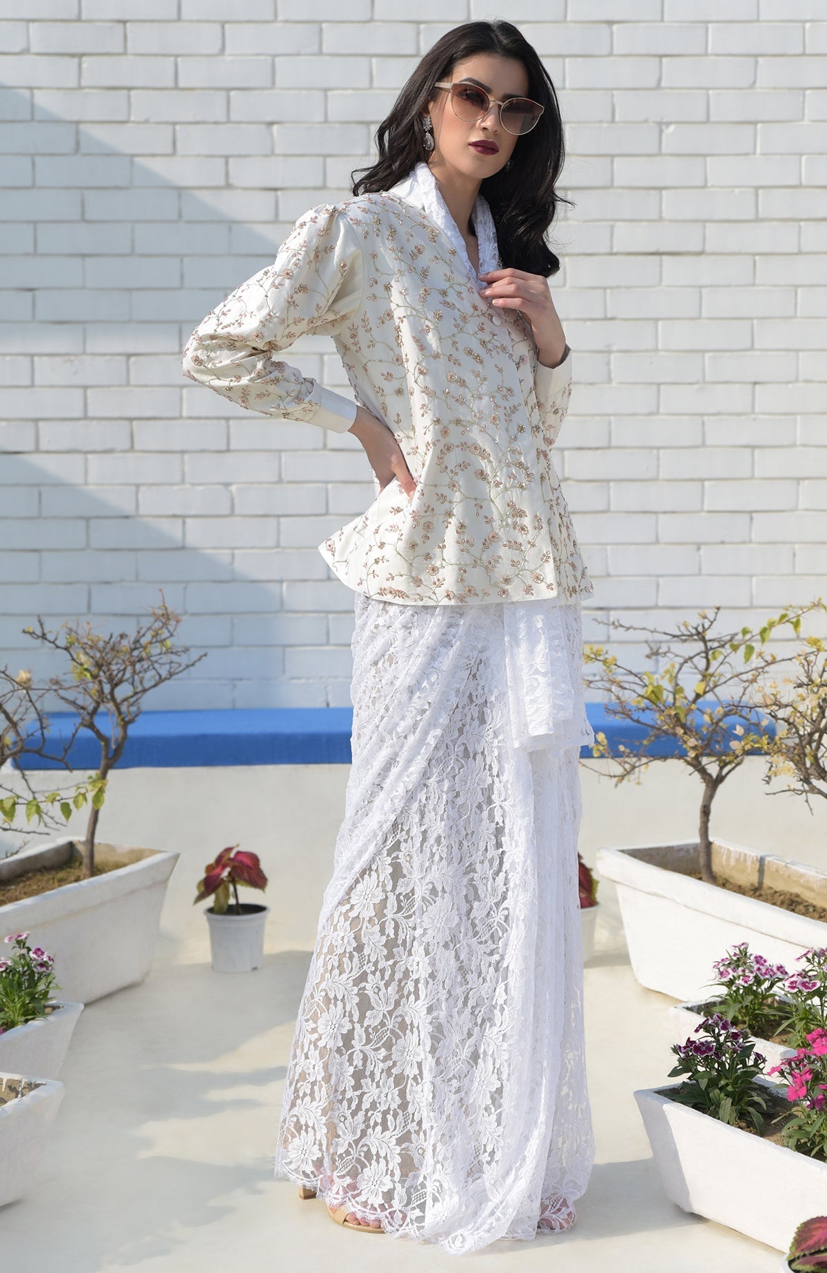 Snowberry sequined ivory-pink hand-embroidered structured jacket with a white lace skirt.