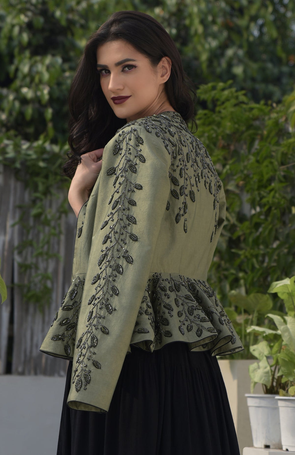 Dark foliage sequin hand embroidered structured peplum jacket.