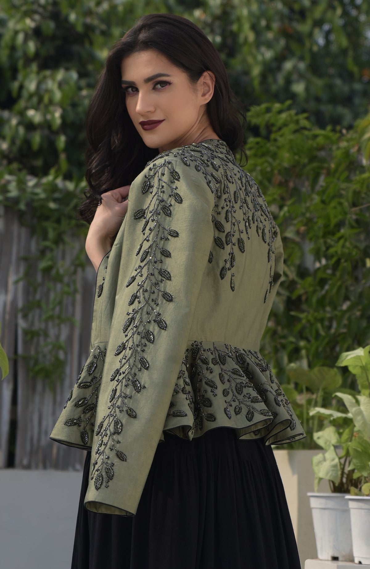 Dark foliage sequin hand-embroidered structured peplum jacket.