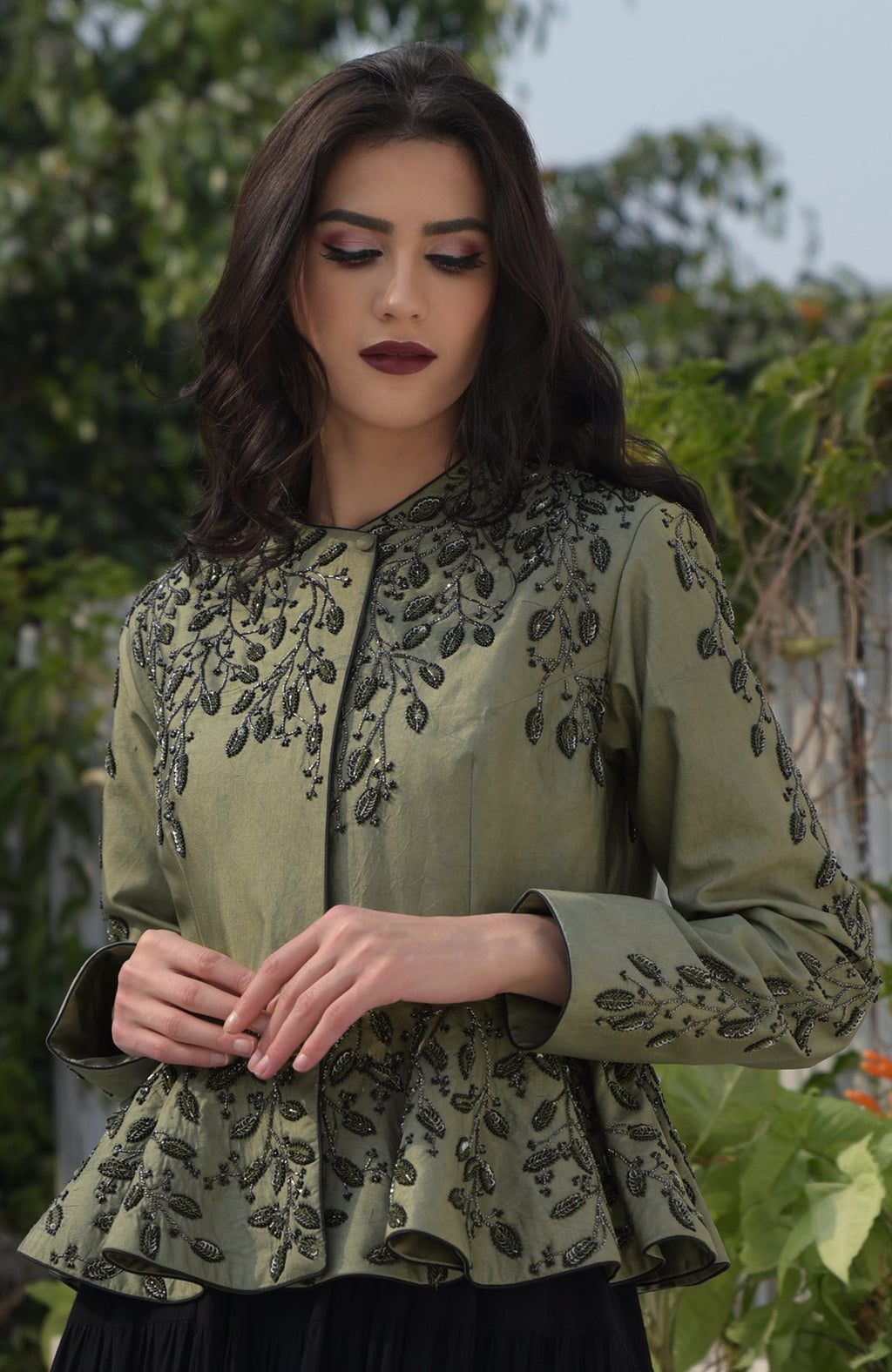 Dark foliage sequin hand-embroidered structured peplum jacket.