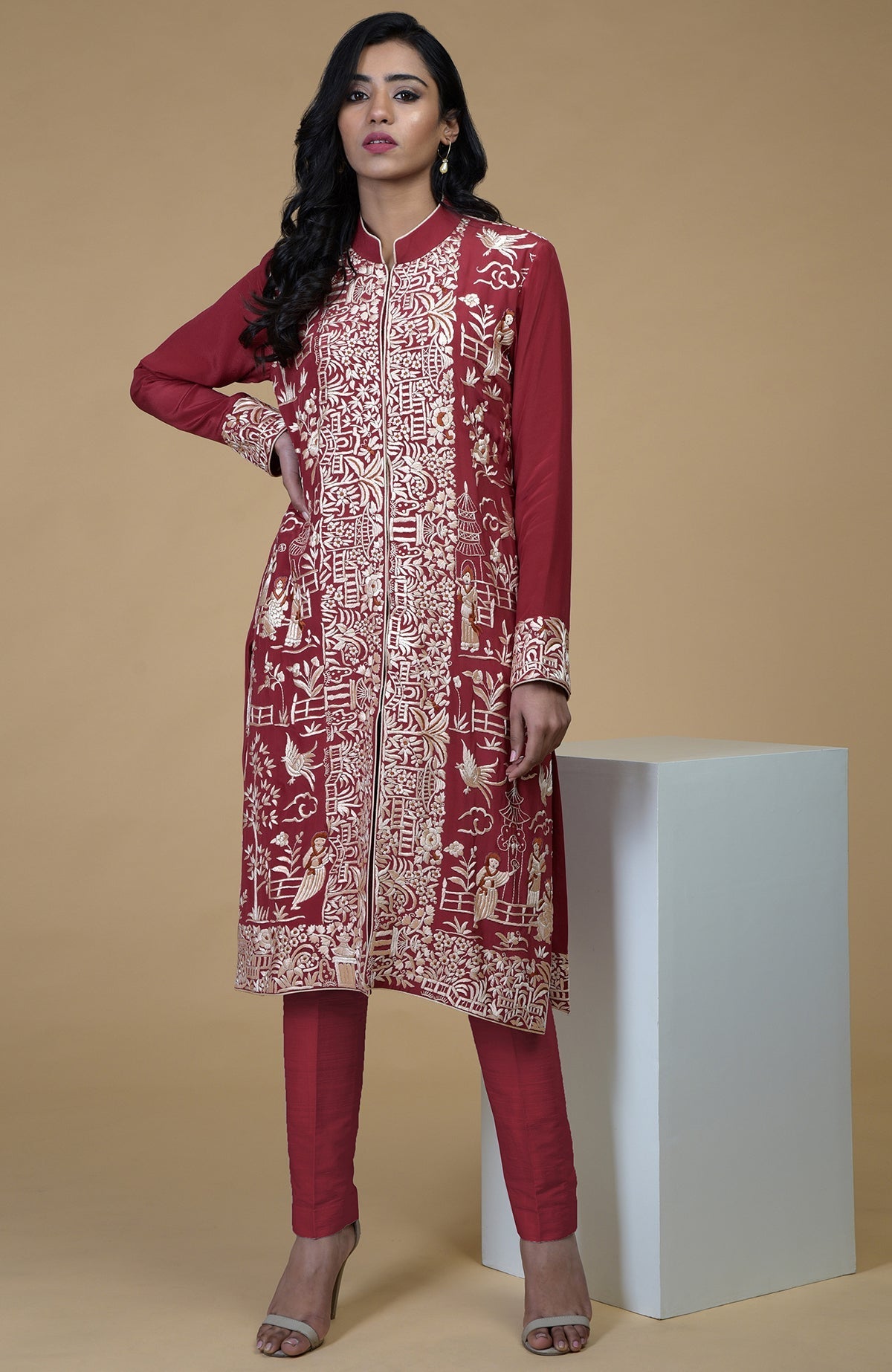 Shiraz red Parsi Gara embroidered jacket with beige, orange, and lilac Cheena Cheeni motifs.