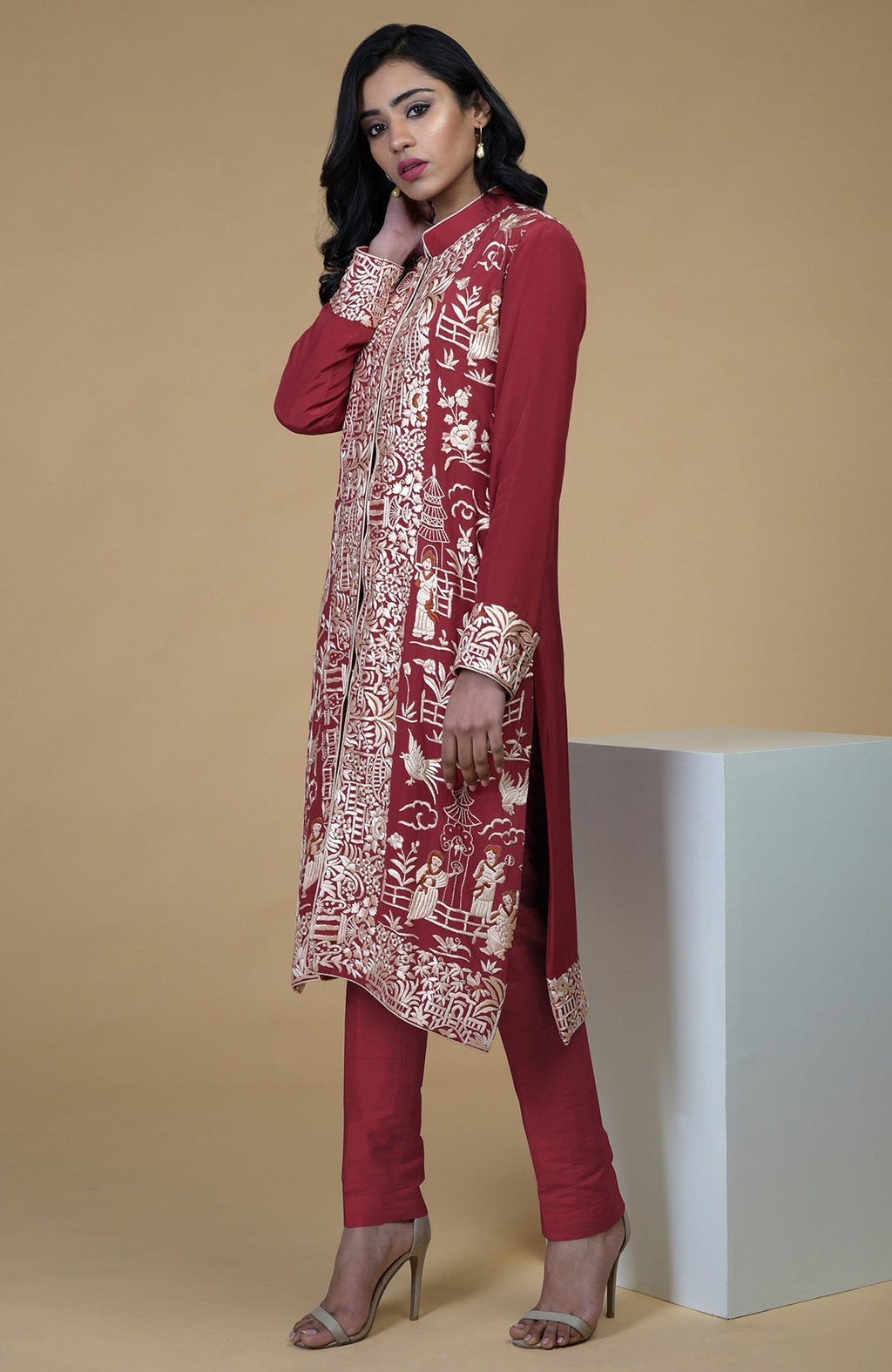 Shiraz red Parsi Gara embroidered jacket with band collar and beige straight pants set.