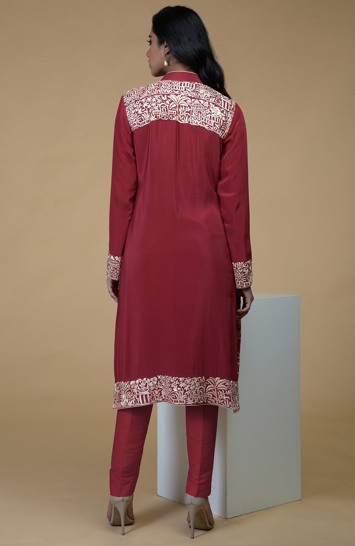 Shiraz red Parsi Gara embroidered jacket with beige, orange, lilac motifs and matching beige pants.