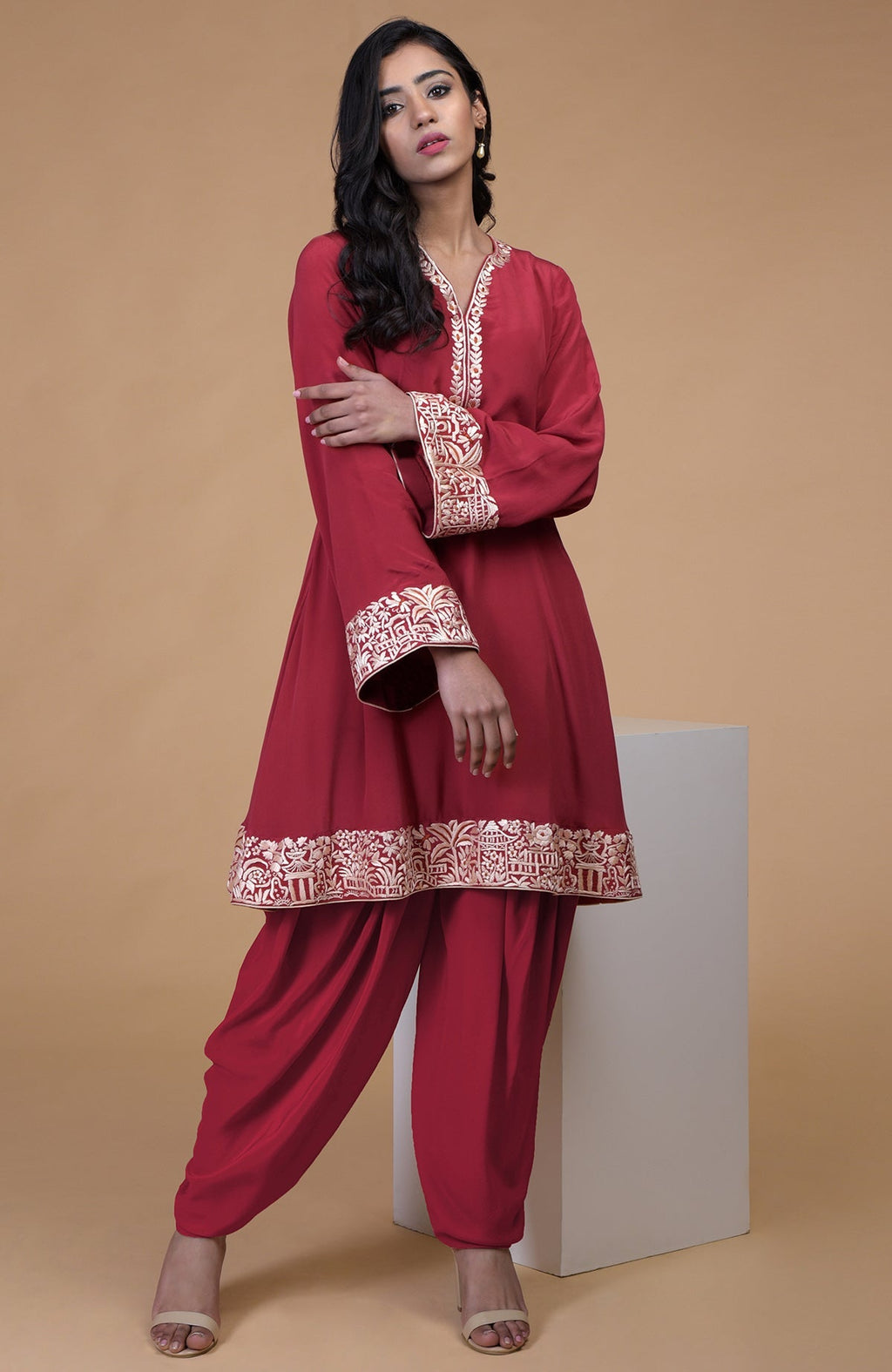 Shiraz red kurta with beige floral Parsi gara embroidery on hem, neckline, and sleeves paired with matching pants