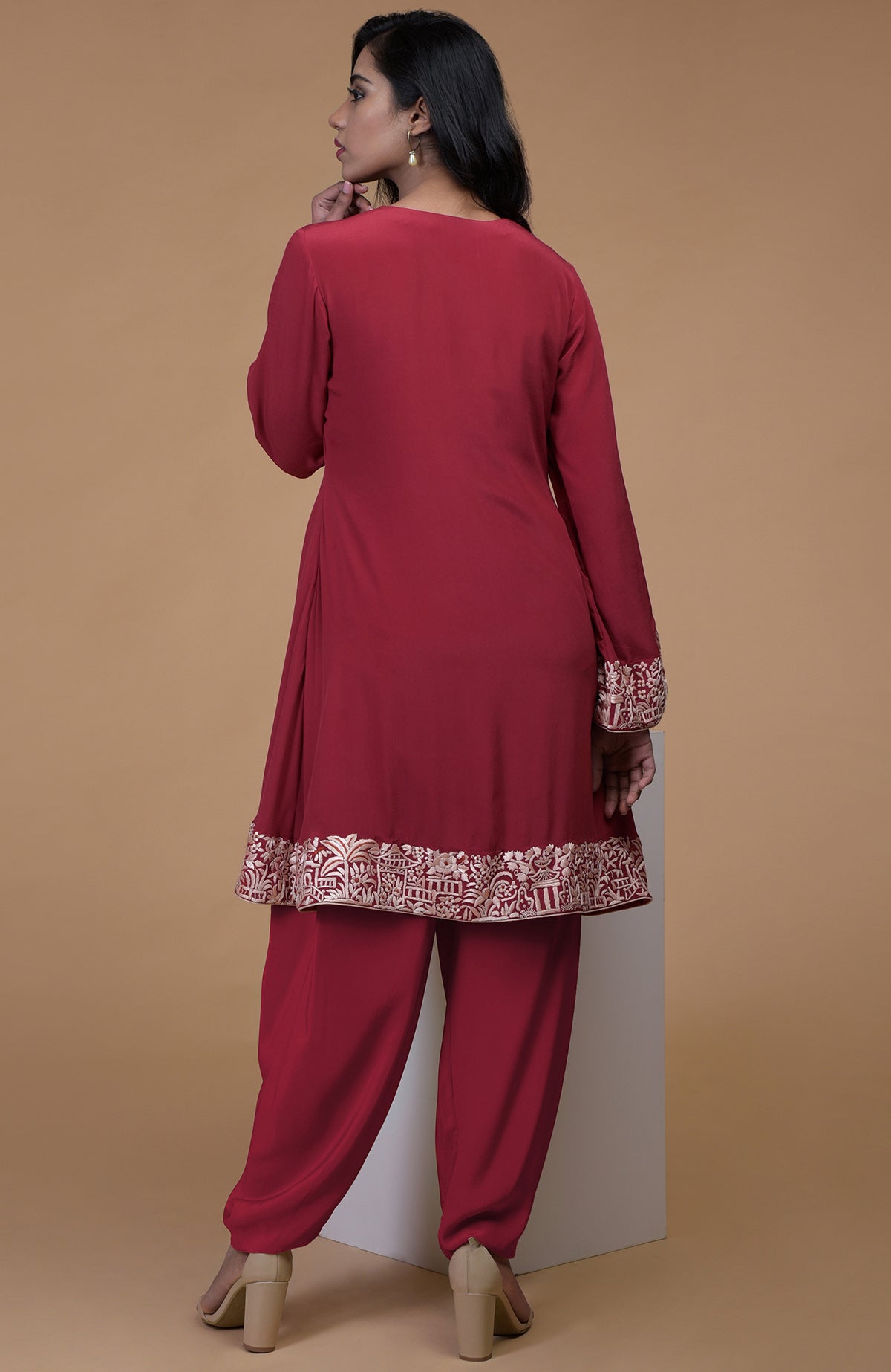 Shiraz red kurta with beige floral Parsi Gara embroidery and matching dhoti pants.
