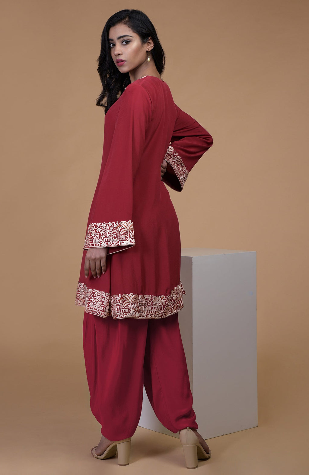 Shiraz red kurta with beige floral Parsi Gara embroidery on hem, neckline, and sleeves.