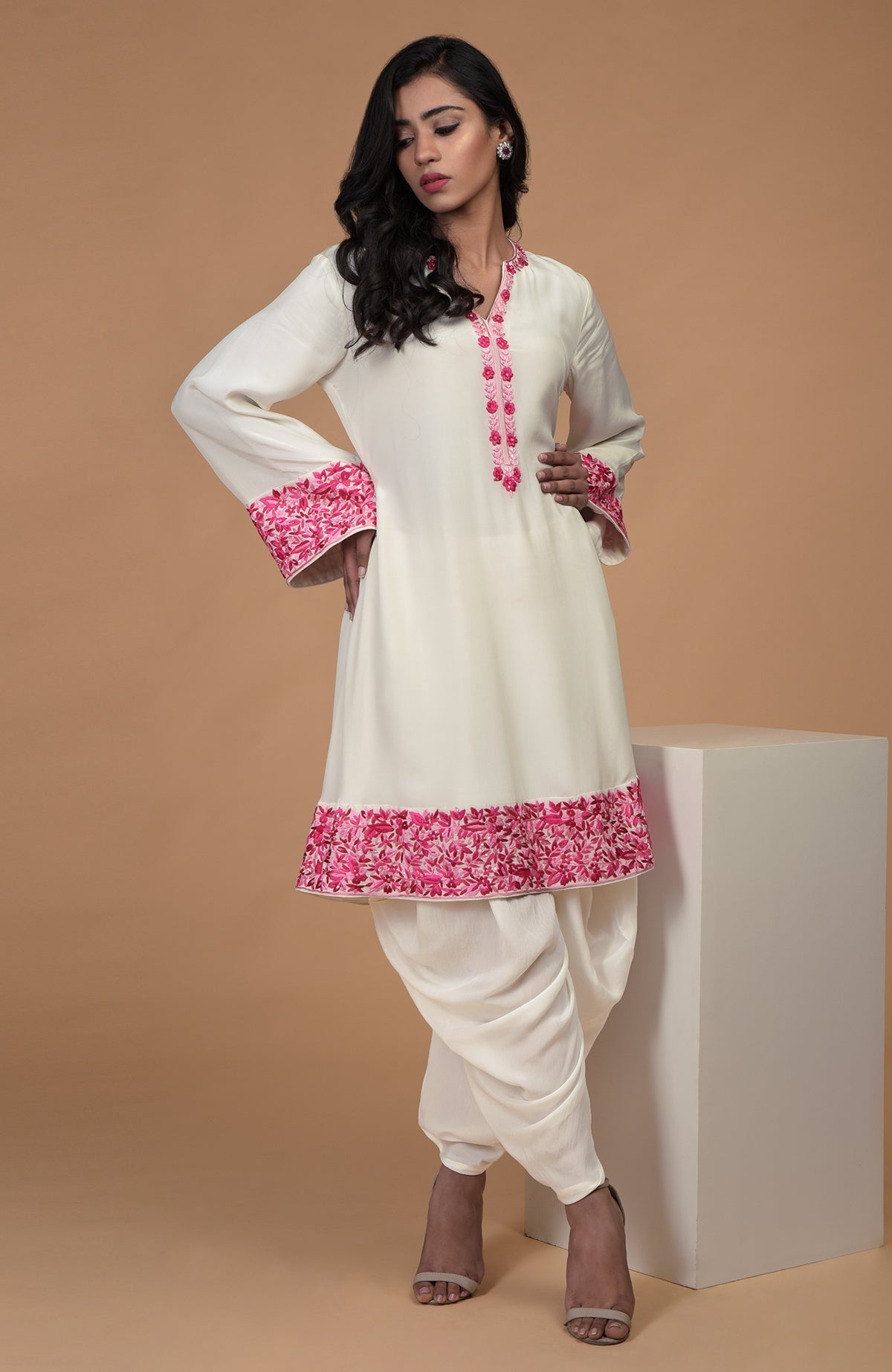 Ivory short kurta with pink Parsi Gara floral embroidery paired with ivory dhoti pants