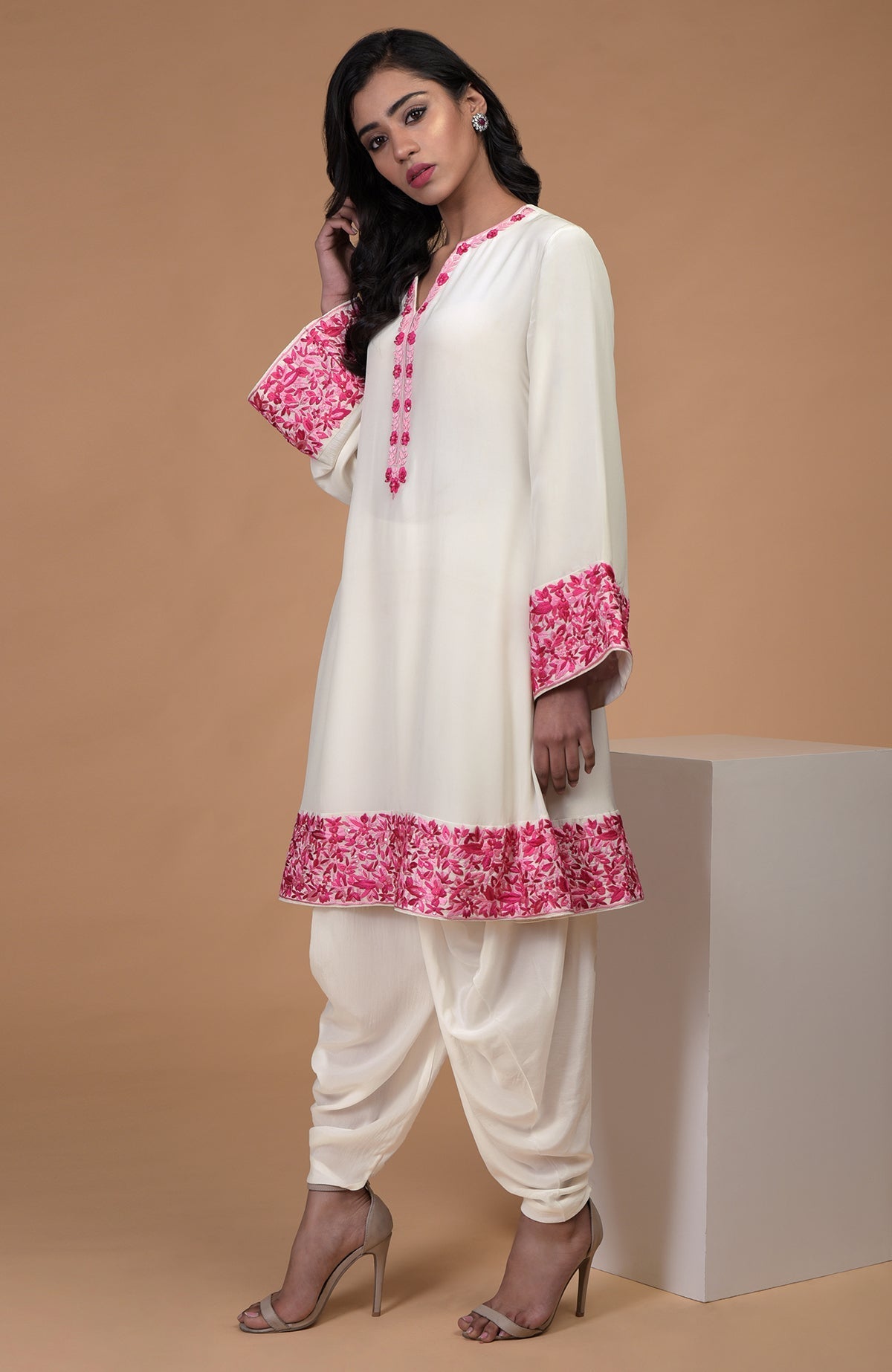 Ivory short kurta with pink Parsi Gara floral embroidery and matching ivory dhoti pants.