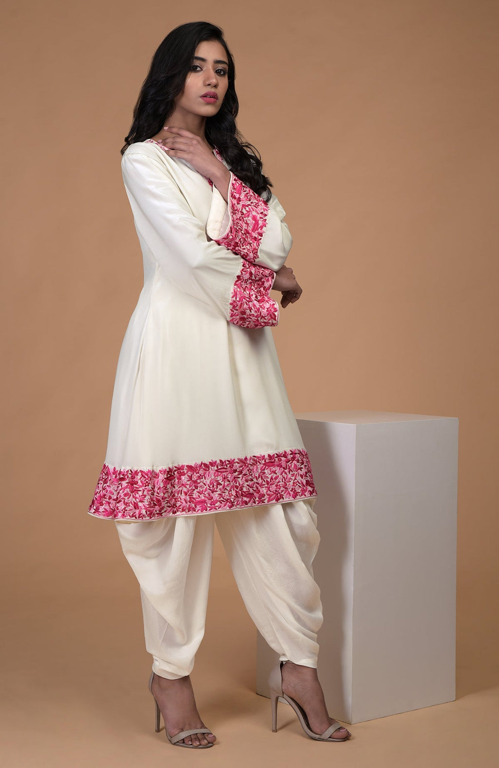 Ivory short kurta with pink Parsi Gara floral embroidery and matching ivory dhoti pants.