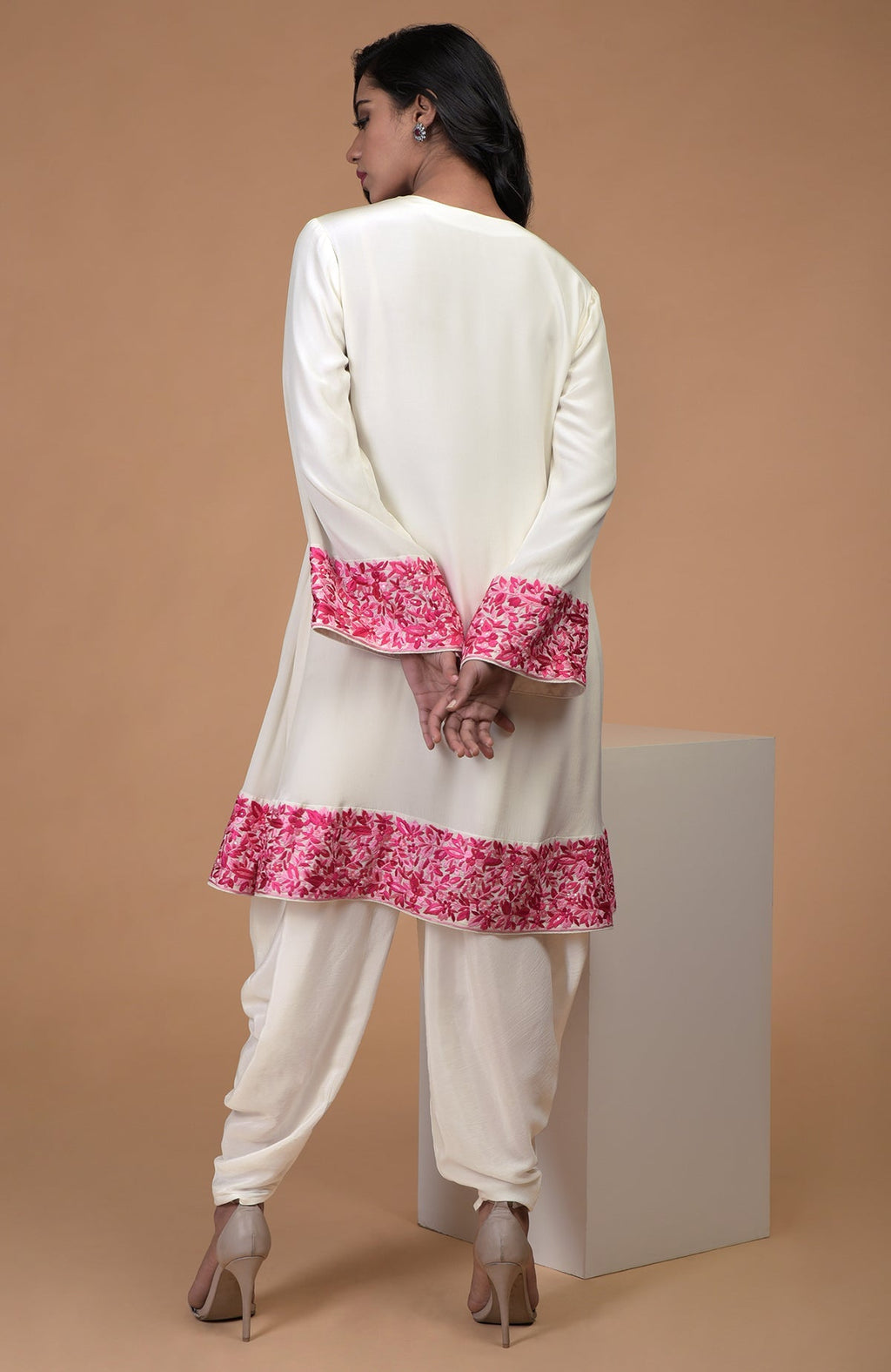 Ivory short kurta with pink Parsi Gara floral embroidery and matching ivory dhoti pants.
