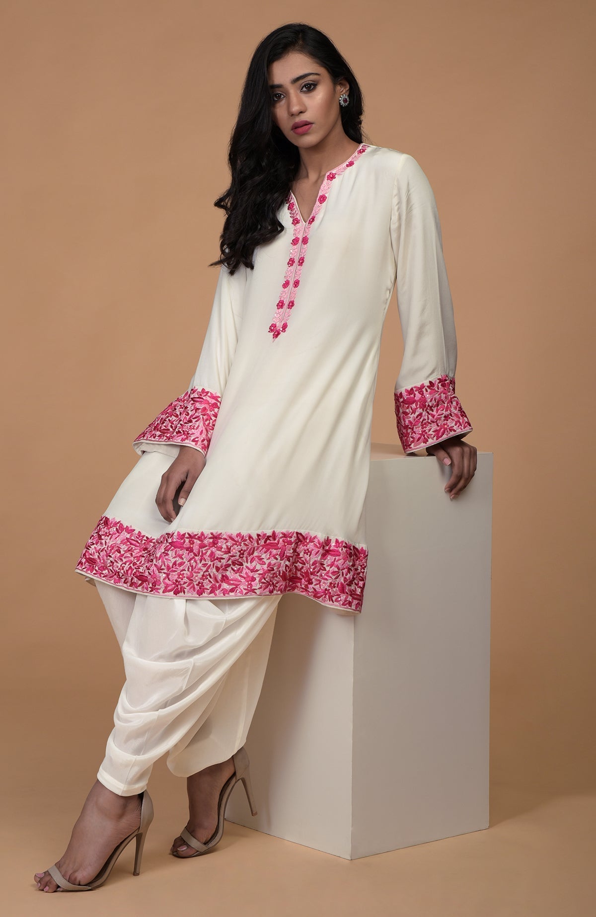 Ivory short kurta with pink Parsi Gara floral embroidery and matching ivory dhoti pants.