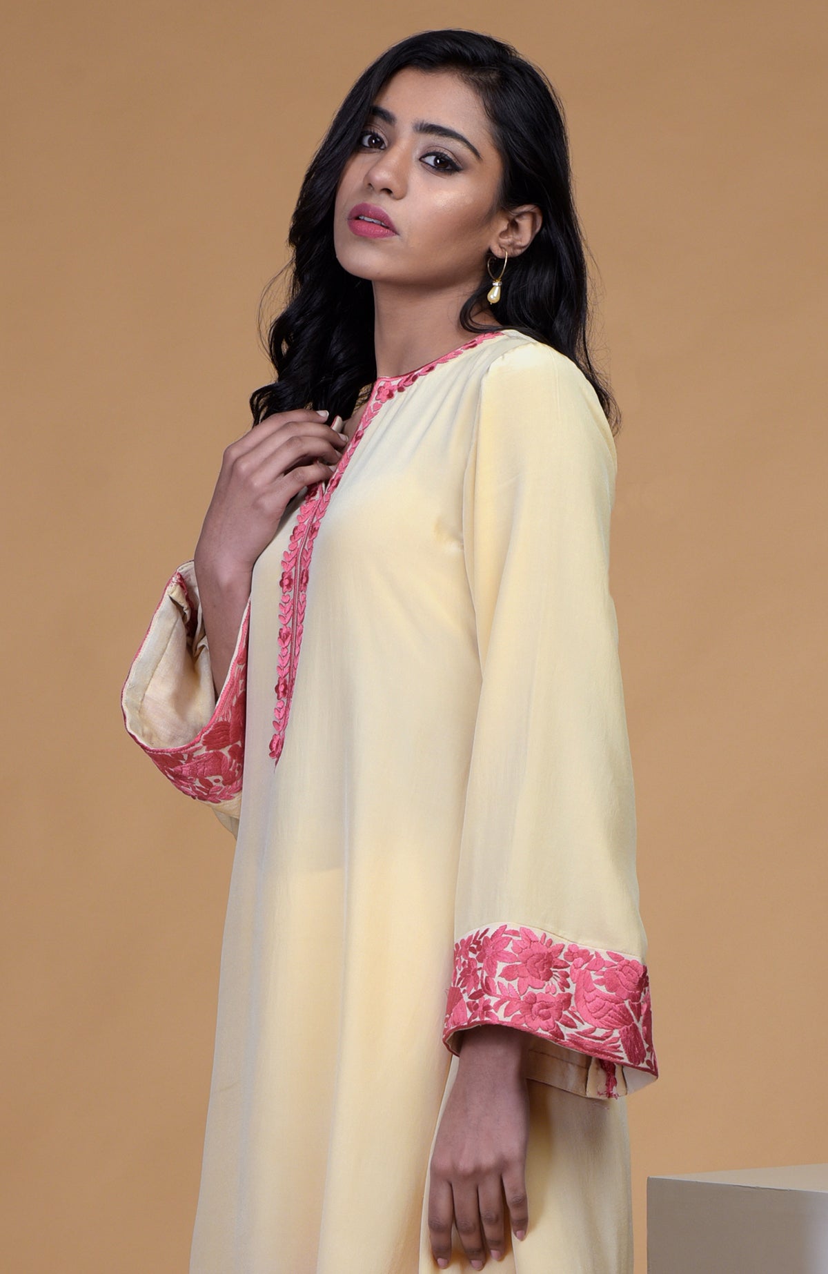 Beige short kurta with rose wine floral parsi gara embroidery and matching beige dhoti pants